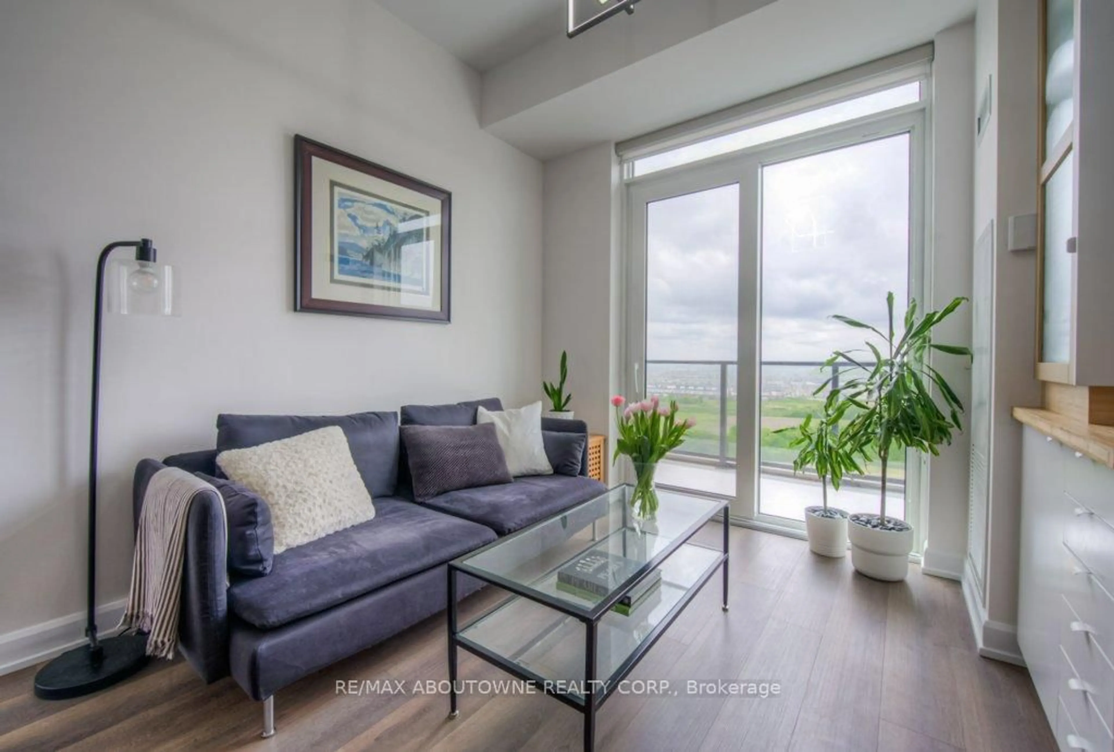 Living room with furniture, unknown for 3200 William Coltson Ave #1404, Oakville Ontario L6H 7W6
