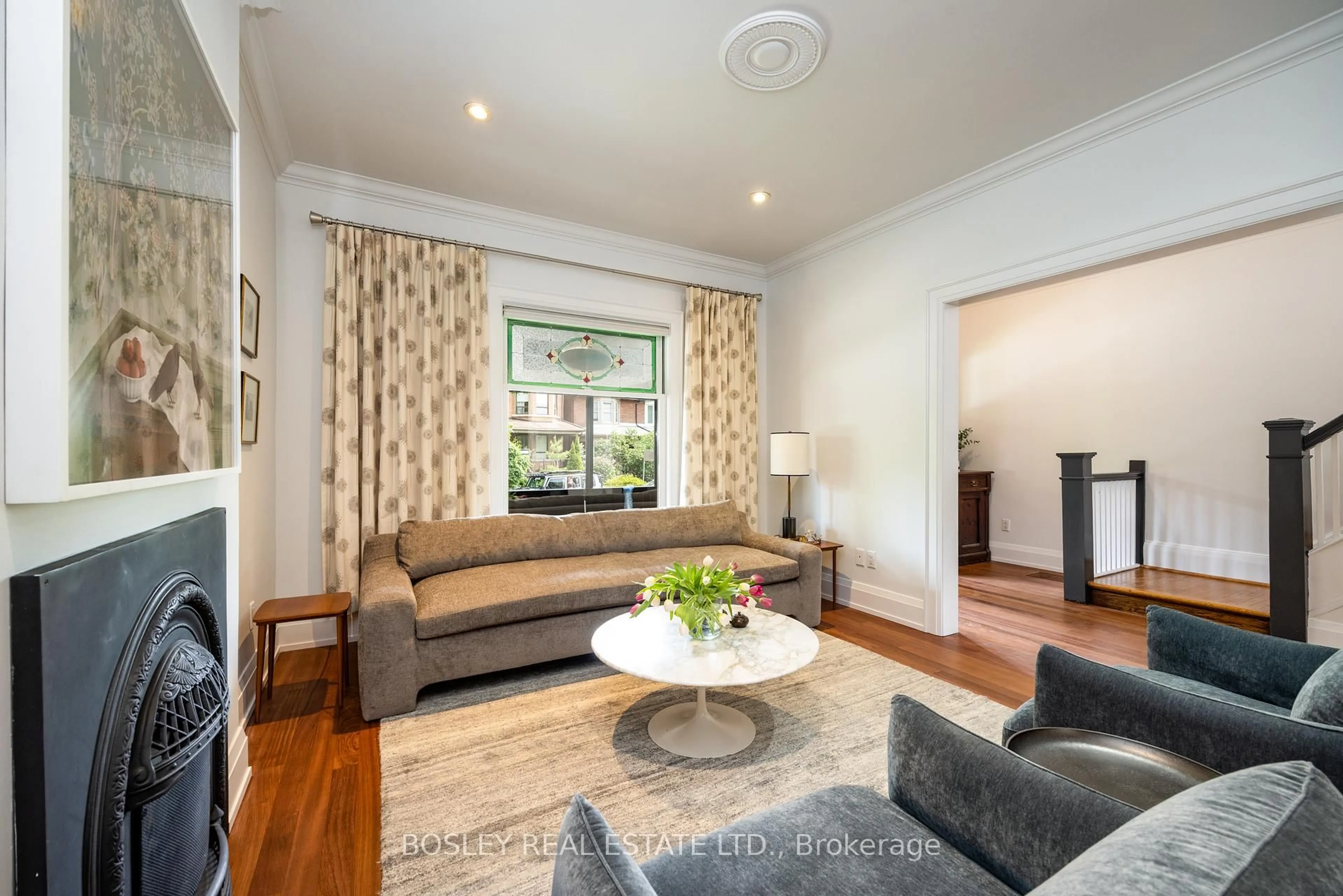 Living room with furniture, wood/laminate floor for 42 Lynd Ave, Toronto Ontario M6R 1T9