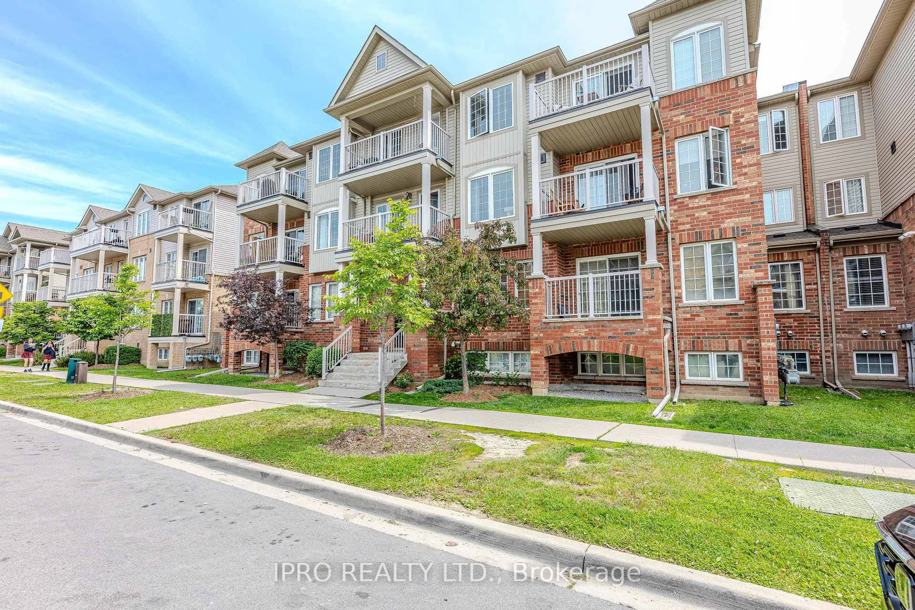 A pic from outside/outdoor area/front of a property/back of a property/a pic from drone, street for 153 Isaac Devins Blvd #2, Toronto Ontario M9M 0C5
