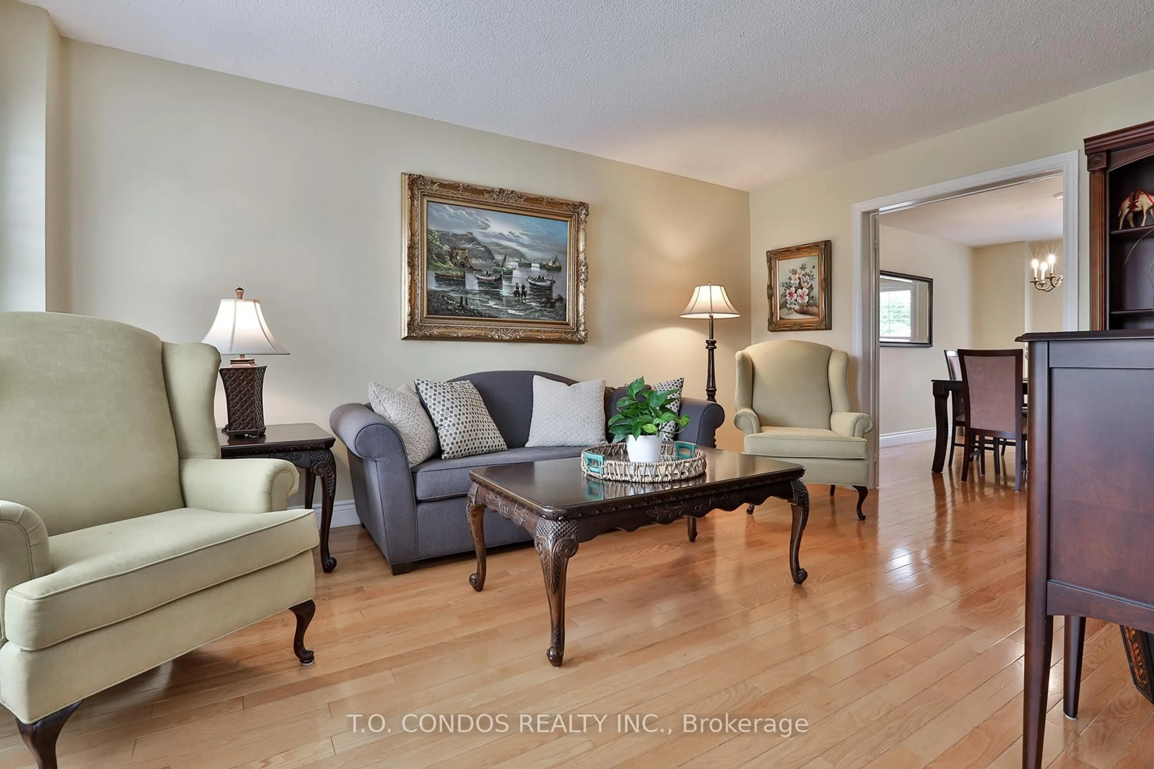 Living room with furniture, wood/laminate floor for 48 Leeward Dr, Brampton Ontario L6S 5V7