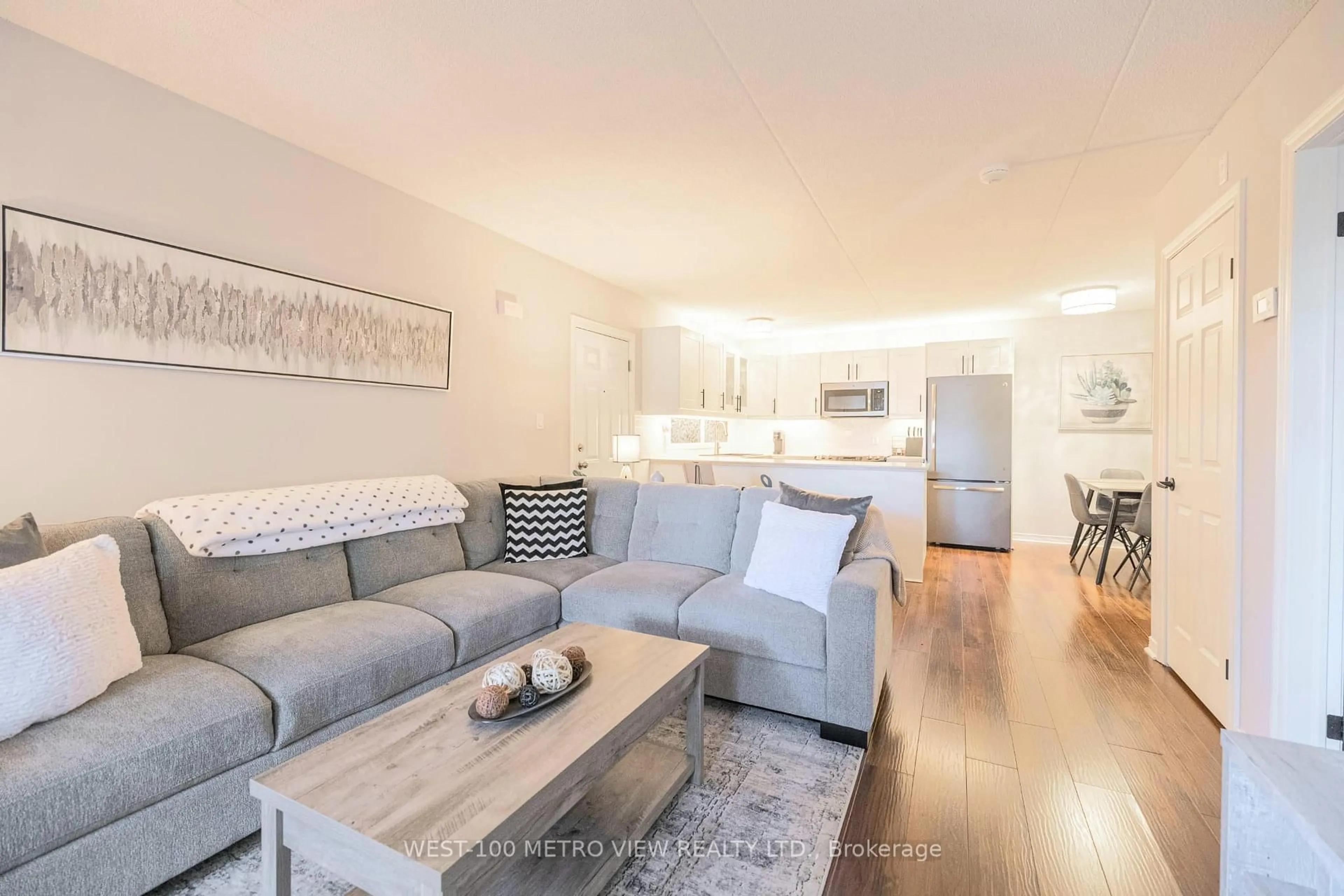 Living room with furniture, wood/laminate floor for 2040 Cleaver Ave #209, Burlington Ontario L7M 4C4