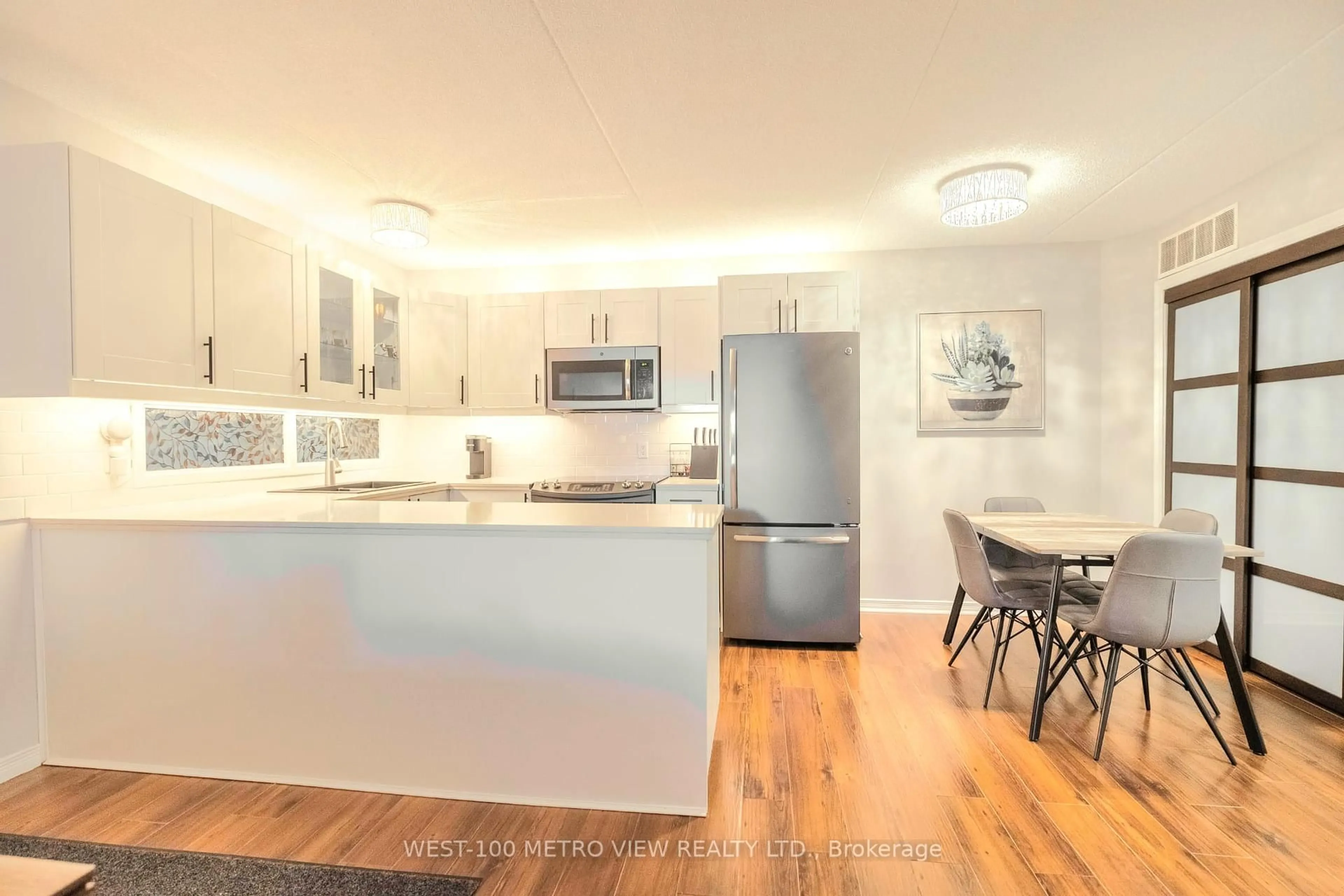 Open concept kitchen, wood/laminate floor for 2040 Cleaver Ave #209, Burlington Ontario L7M 4C4