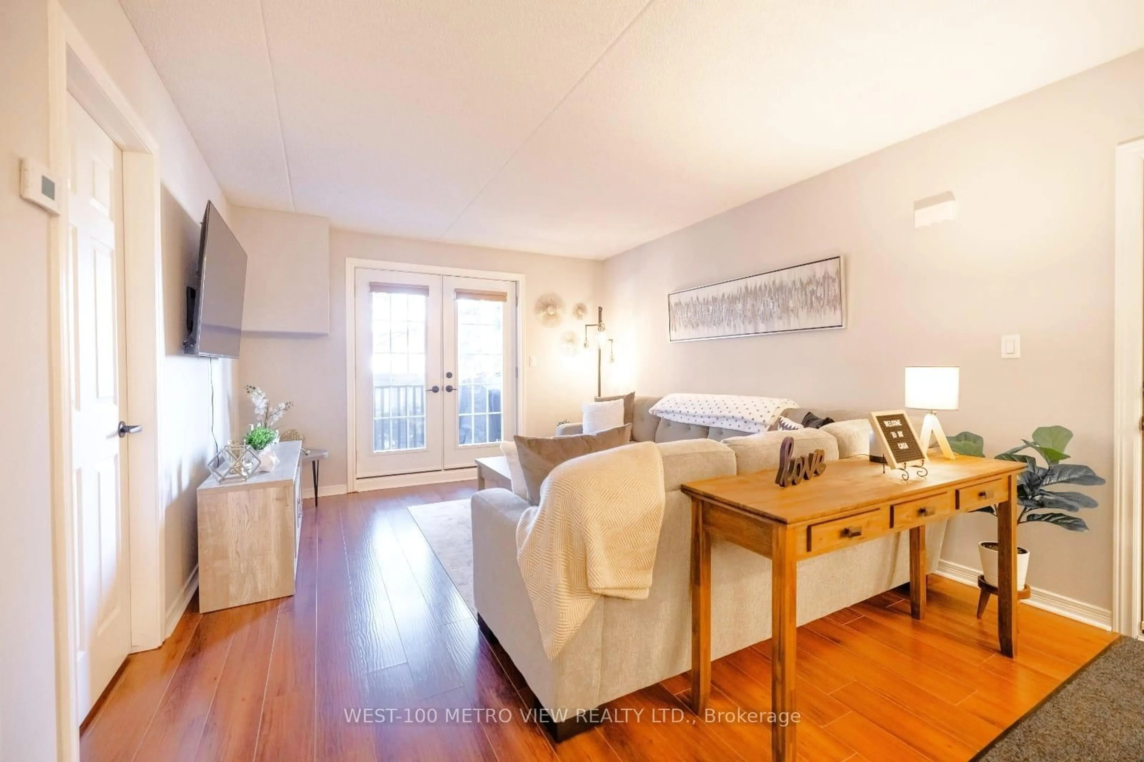 Living room with furniture, wood/laminate floor for 2040 Cleaver Ave #209, Burlington Ontario L7M 4C4