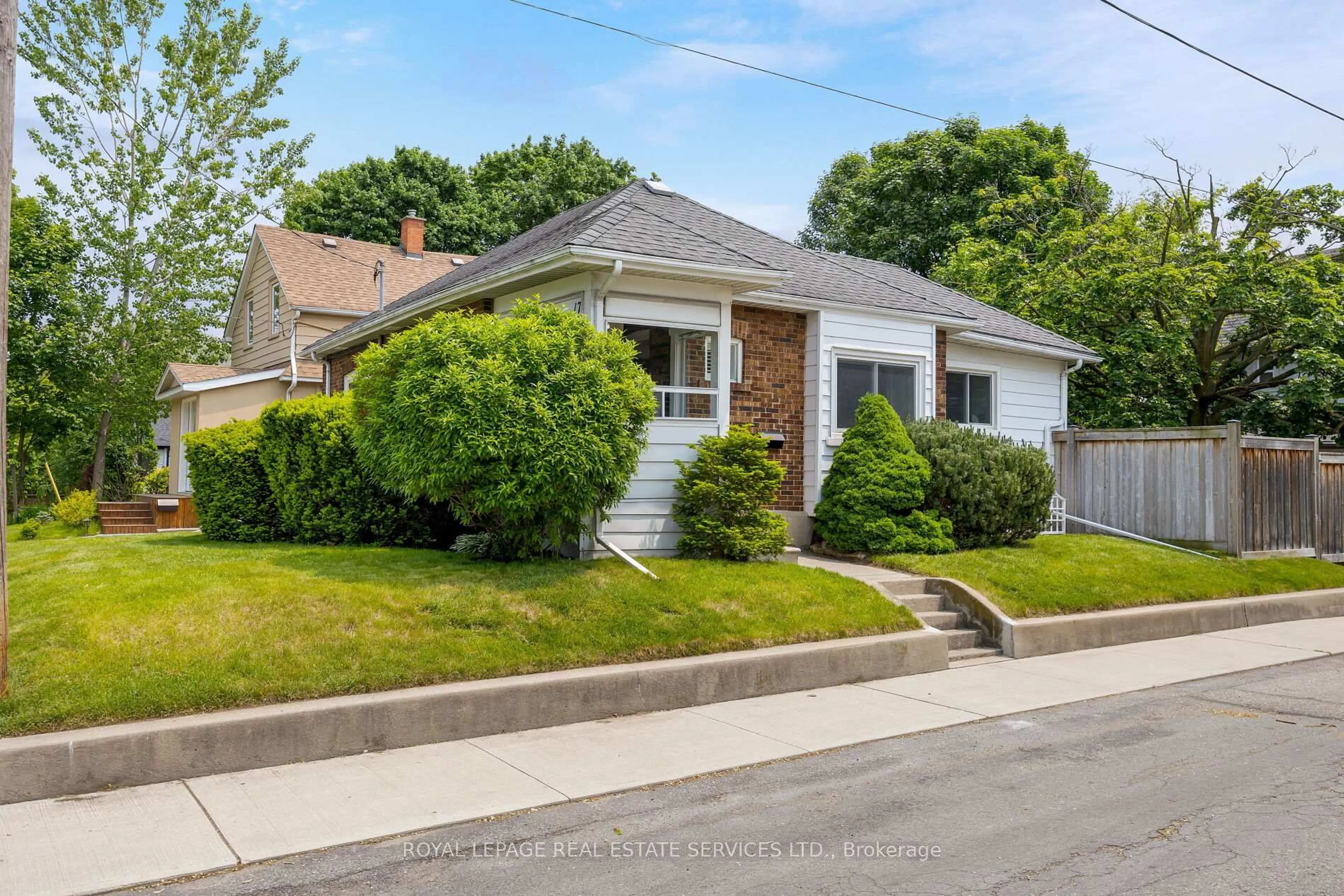 Home with vinyl exterior material, street for 17 Daniels St, Toronto Ontario M8Y 1L6