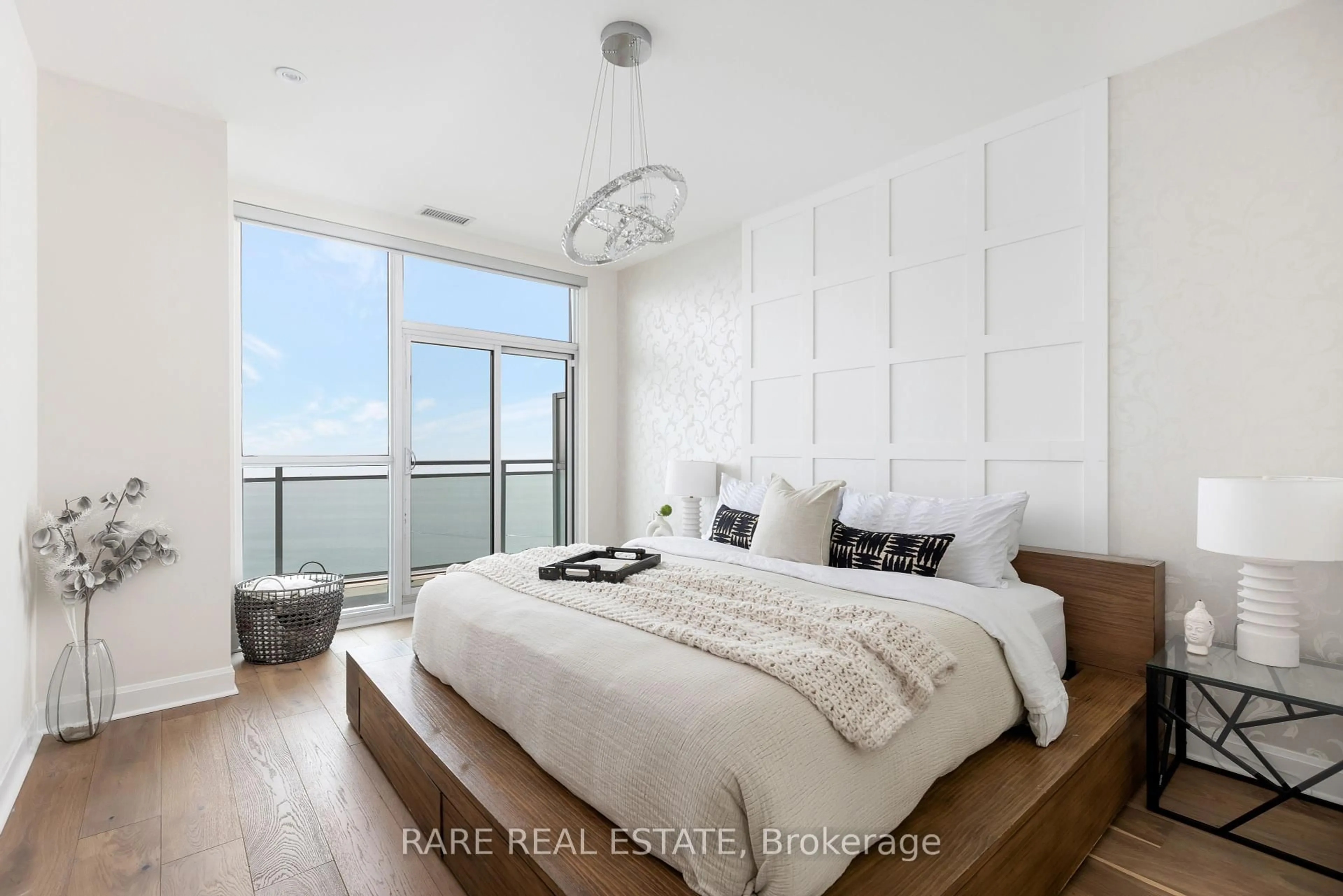 Bedroom with bed, wood/laminate floor for 33 Shore Breeze Dr #UPH4103, Toronto Ontario M8V 0G1