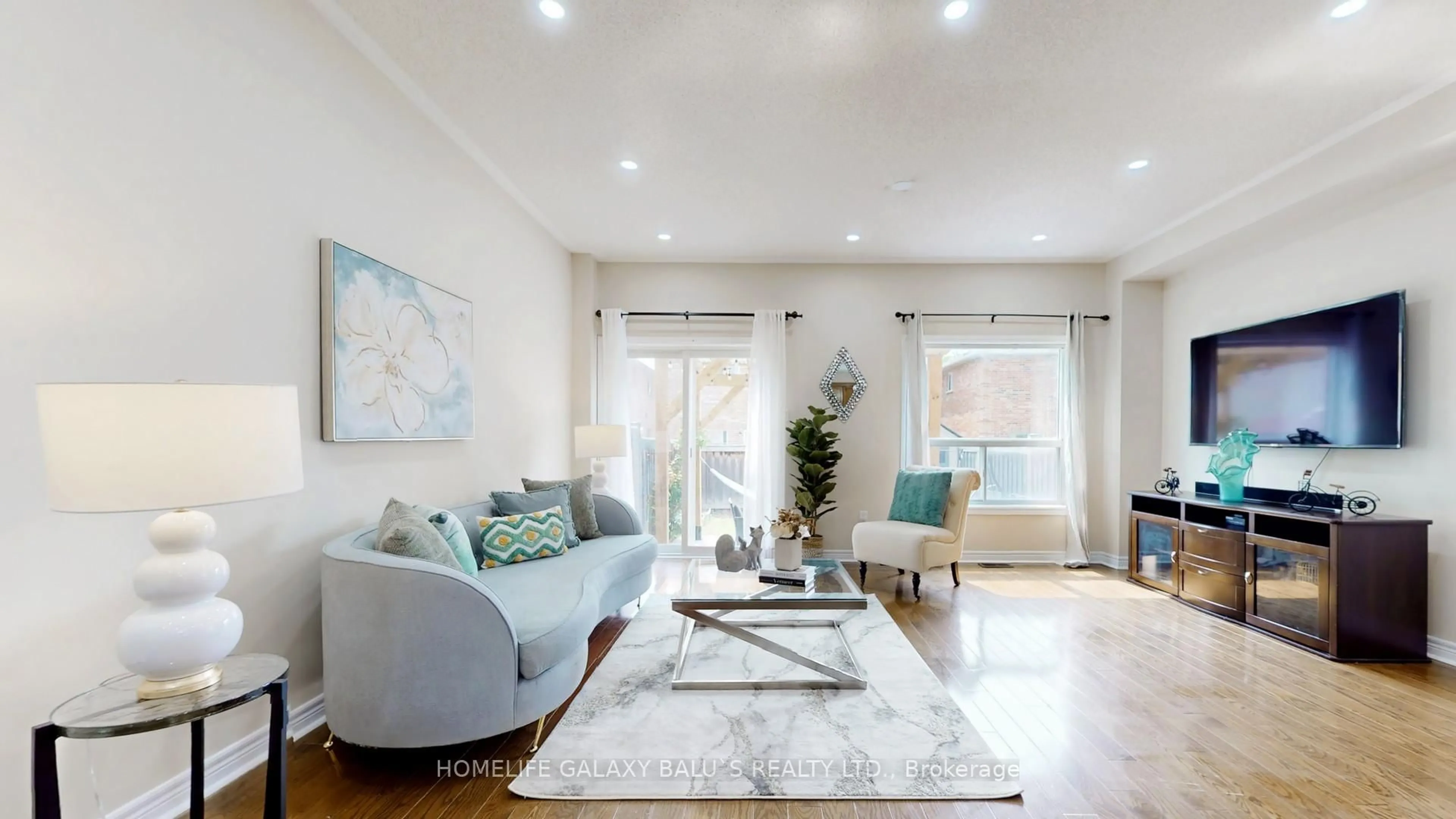 Living room with furniture, wood/laminate floor for 383 Comiskey Cres, Mississauga Ontario L5W 0C6