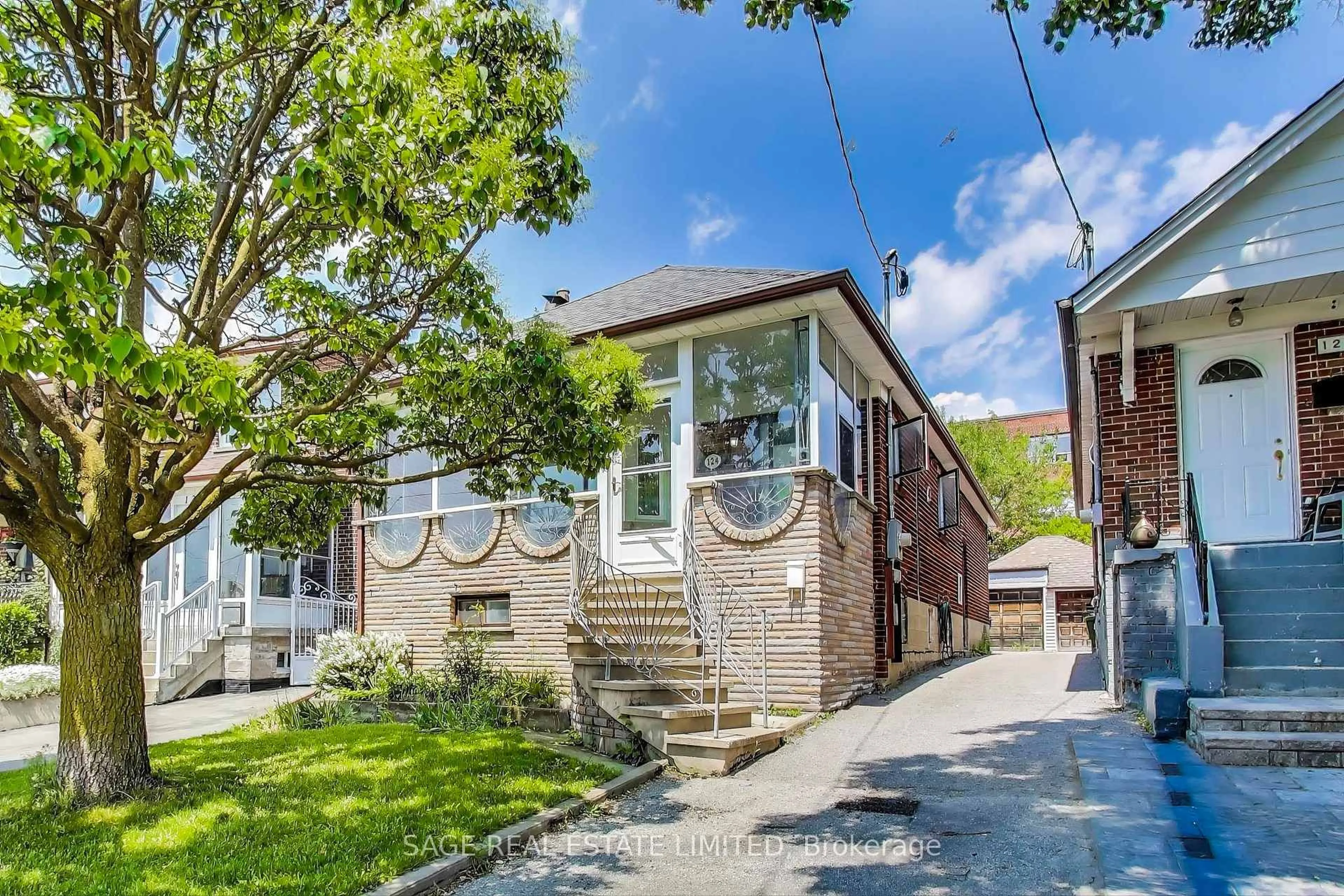 Home with brick exterior material, street for 124 Branstone Rd, Toronto Ontario M6E 4E5