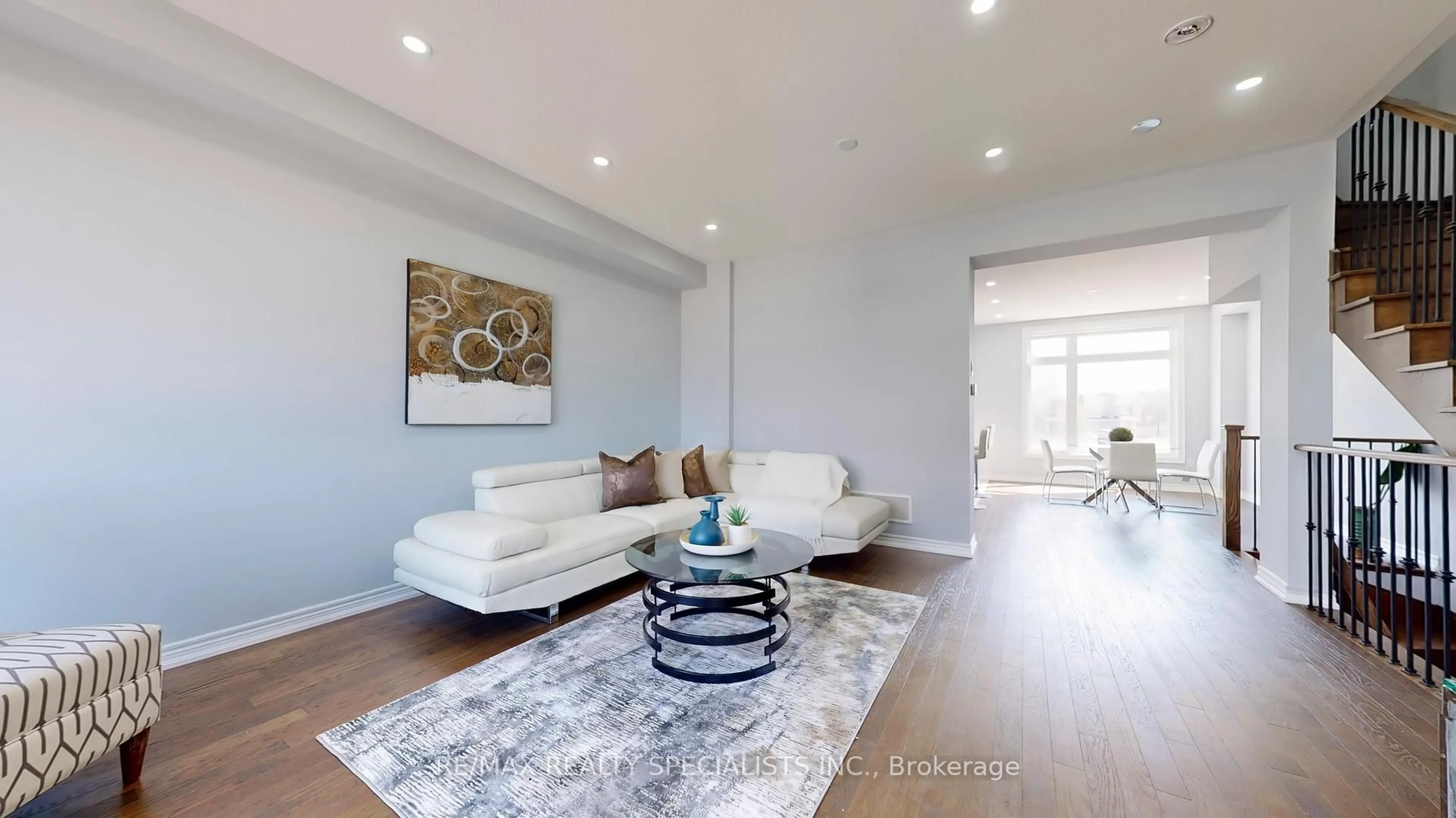 Living room with furniture, wood/laminate floor for 6 QUEENPOST Dr, Brampton Ontario L6Y 6L2
