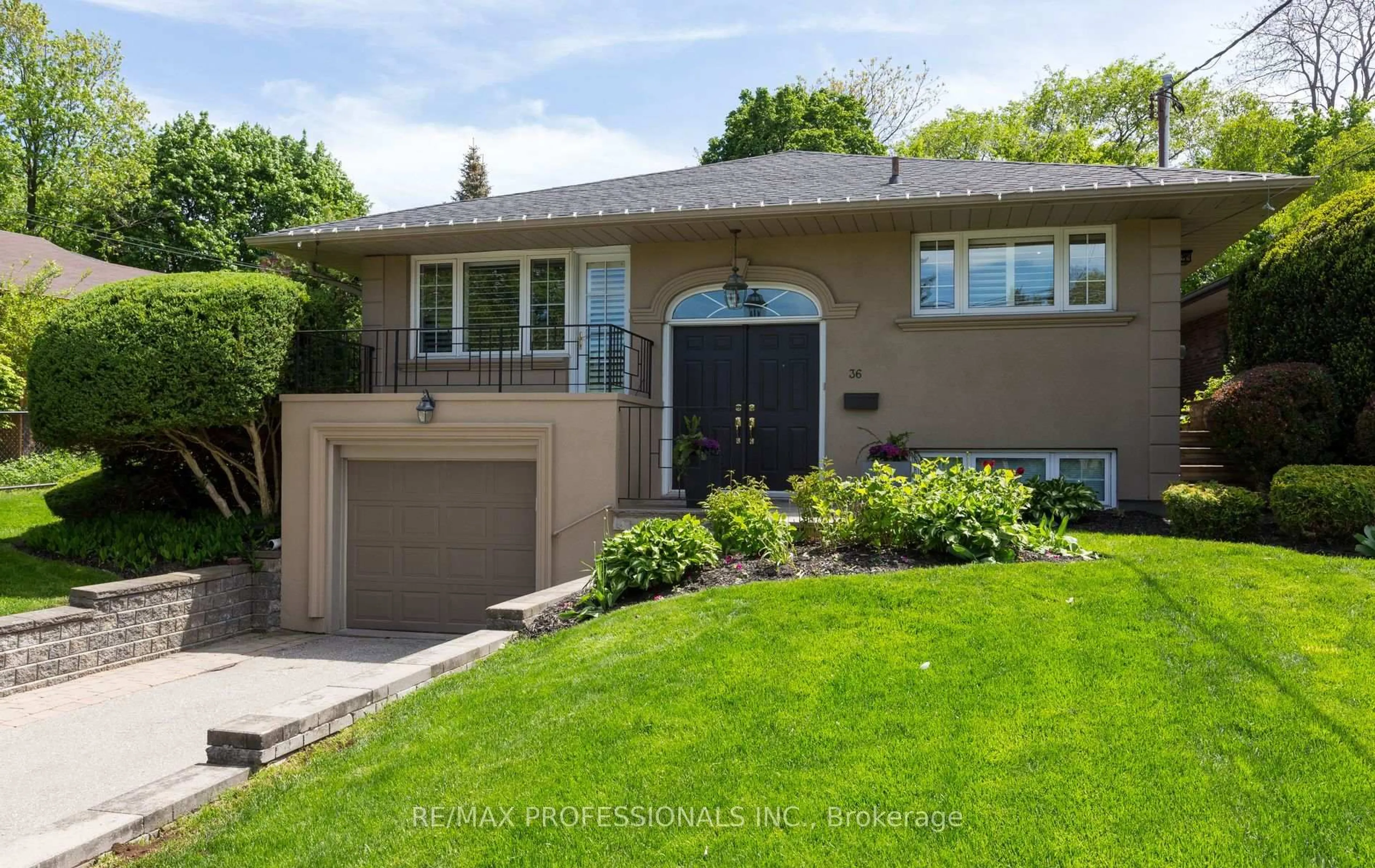 Home with brick exterior material, street for 36 Ravenscrest Dr, Toronto Ontario M9B 5M7