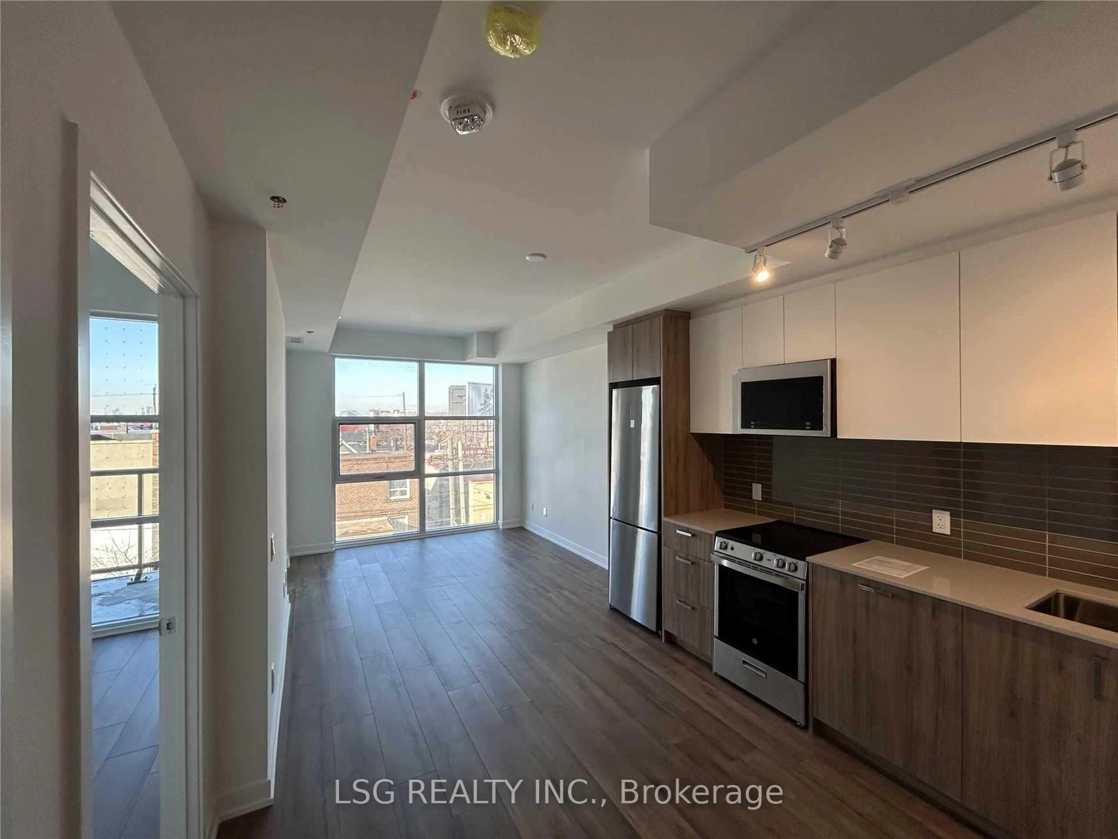 Open concept kitchen, wood/laminate floor for 1787 St Clair Ave #310, Toronto Ontario M6N 0B7