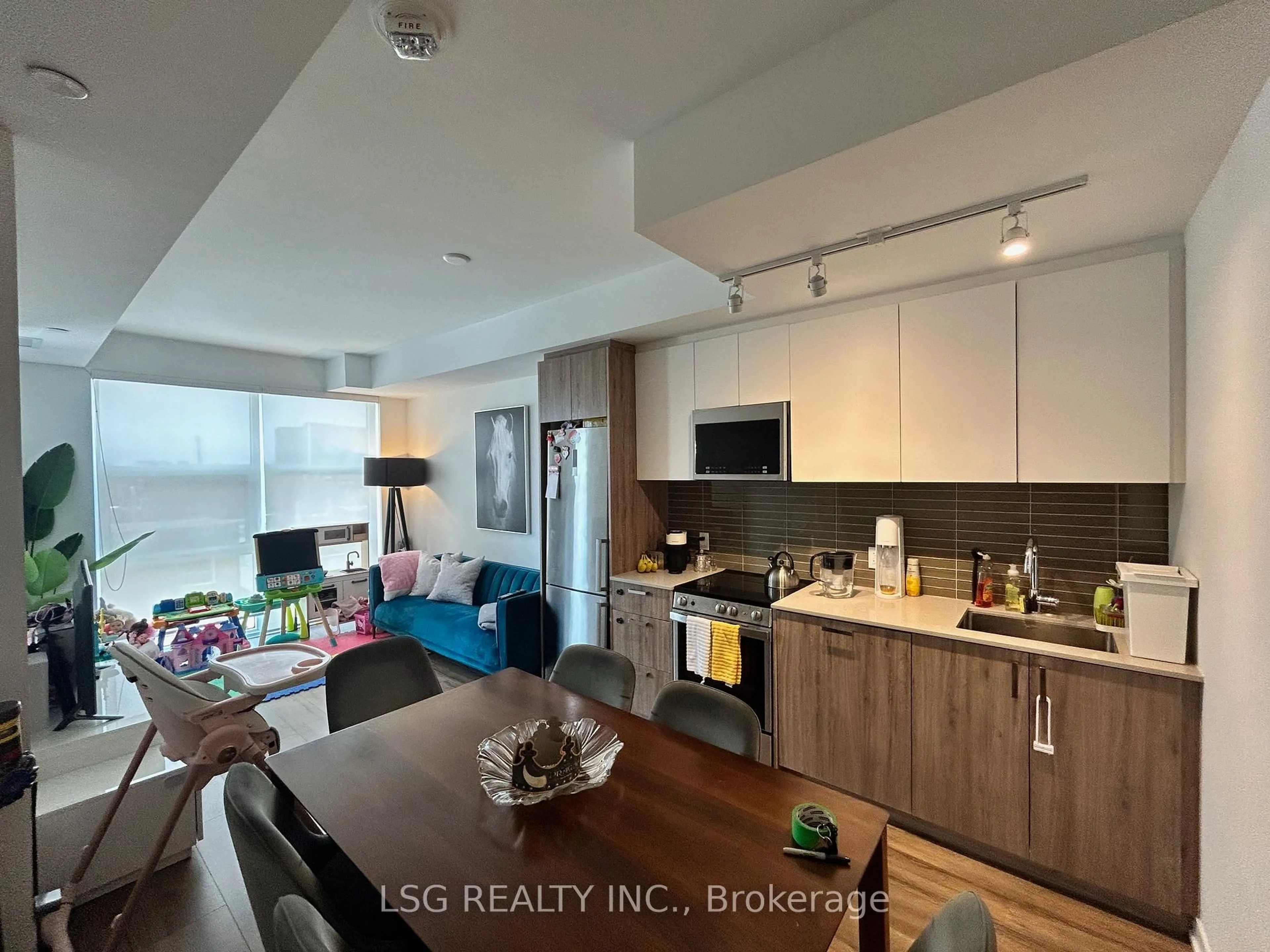 Open concept kitchen, wood/laminate floor for 1787 St Clair Ave #310, Toronto Ontario M6N 0B7