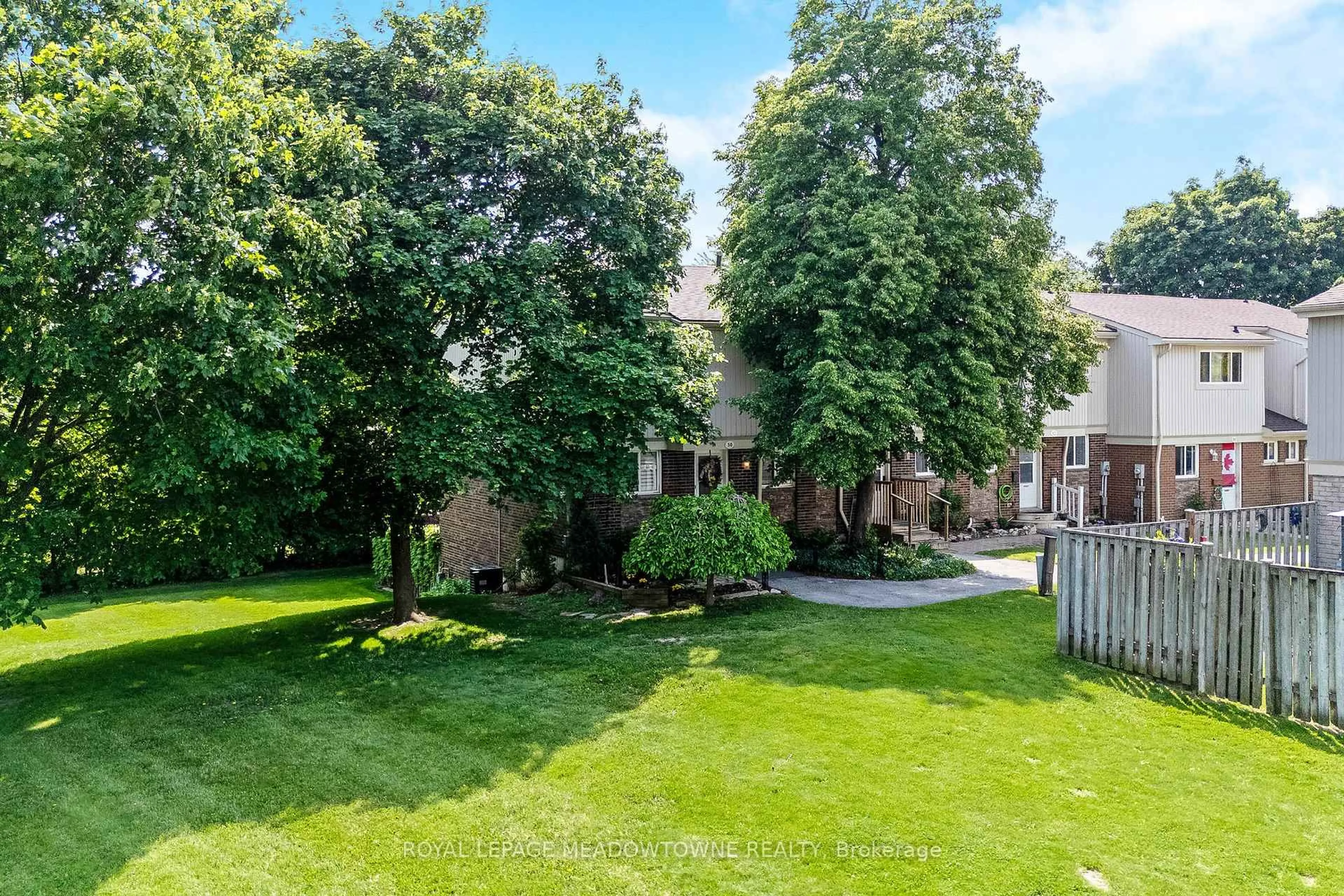 A pic from outside/outdoor area/front of a property/back of a property/a pic from drone, street for 561 Childs Dr #50, Milton Ontario L9T 3Z1