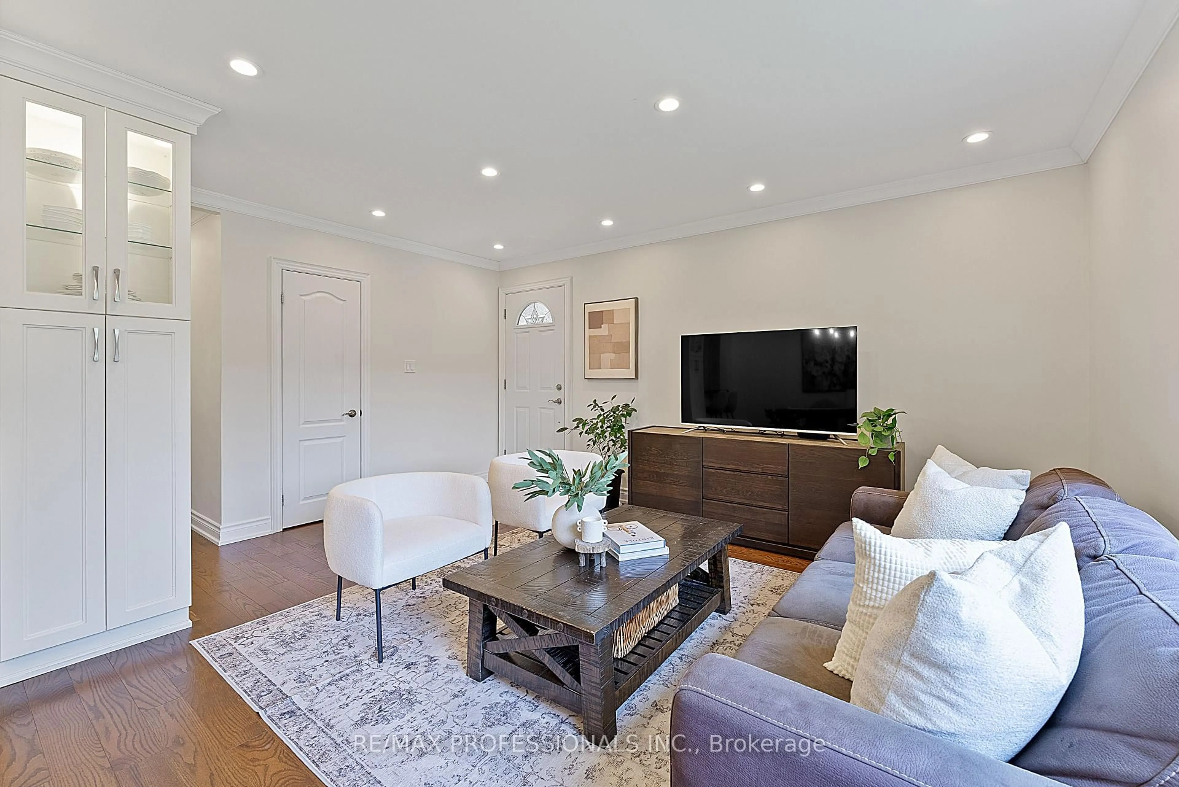 Living room with furniture, wood/laminate floor for 24 Castlebar Rd, Toronto Ontario M8Z 2J5