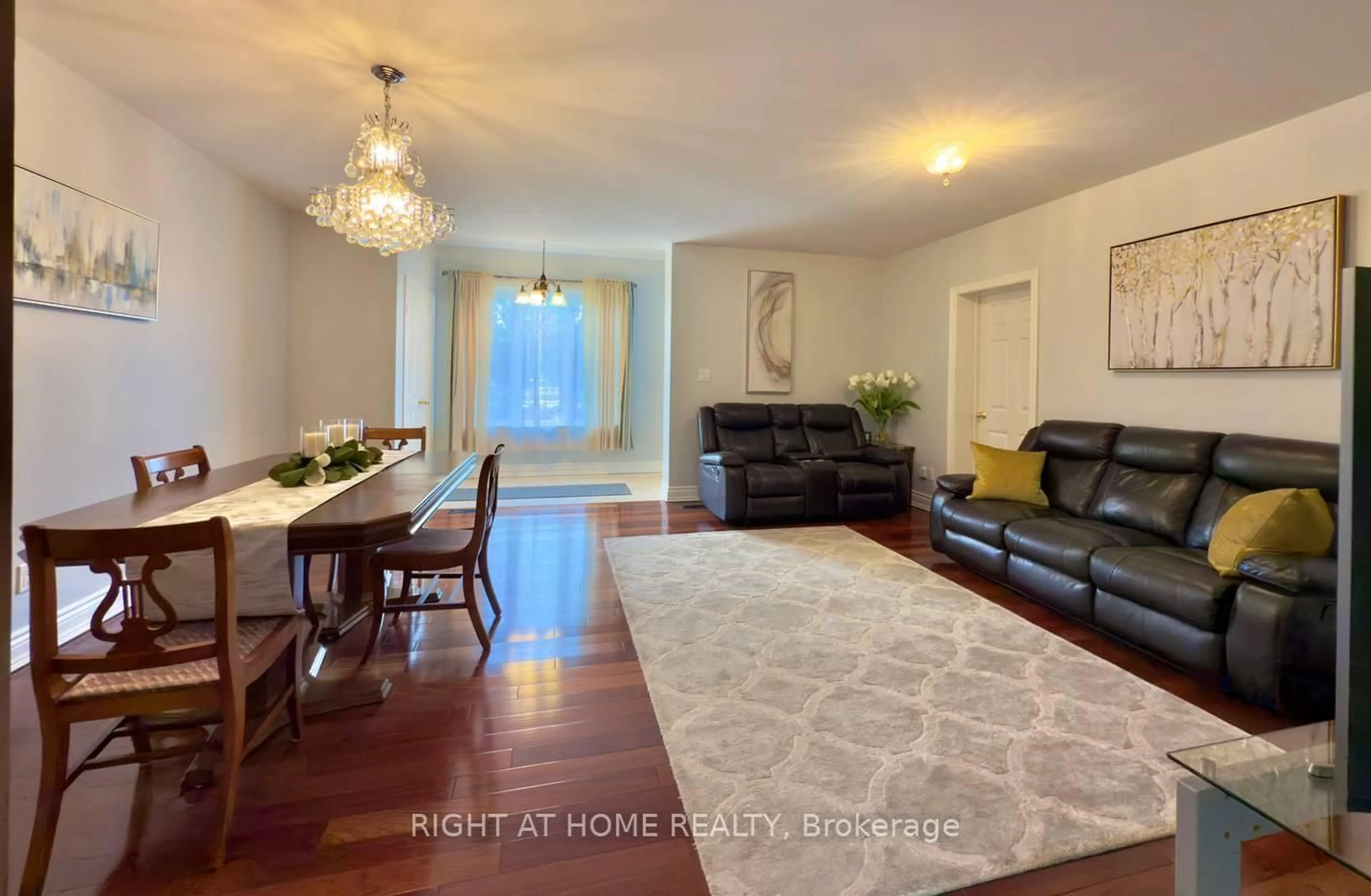 Living room with furniture, wood/laminate floor for 25 Burlingame Rd, Toronto Ontario M8W 1Y7