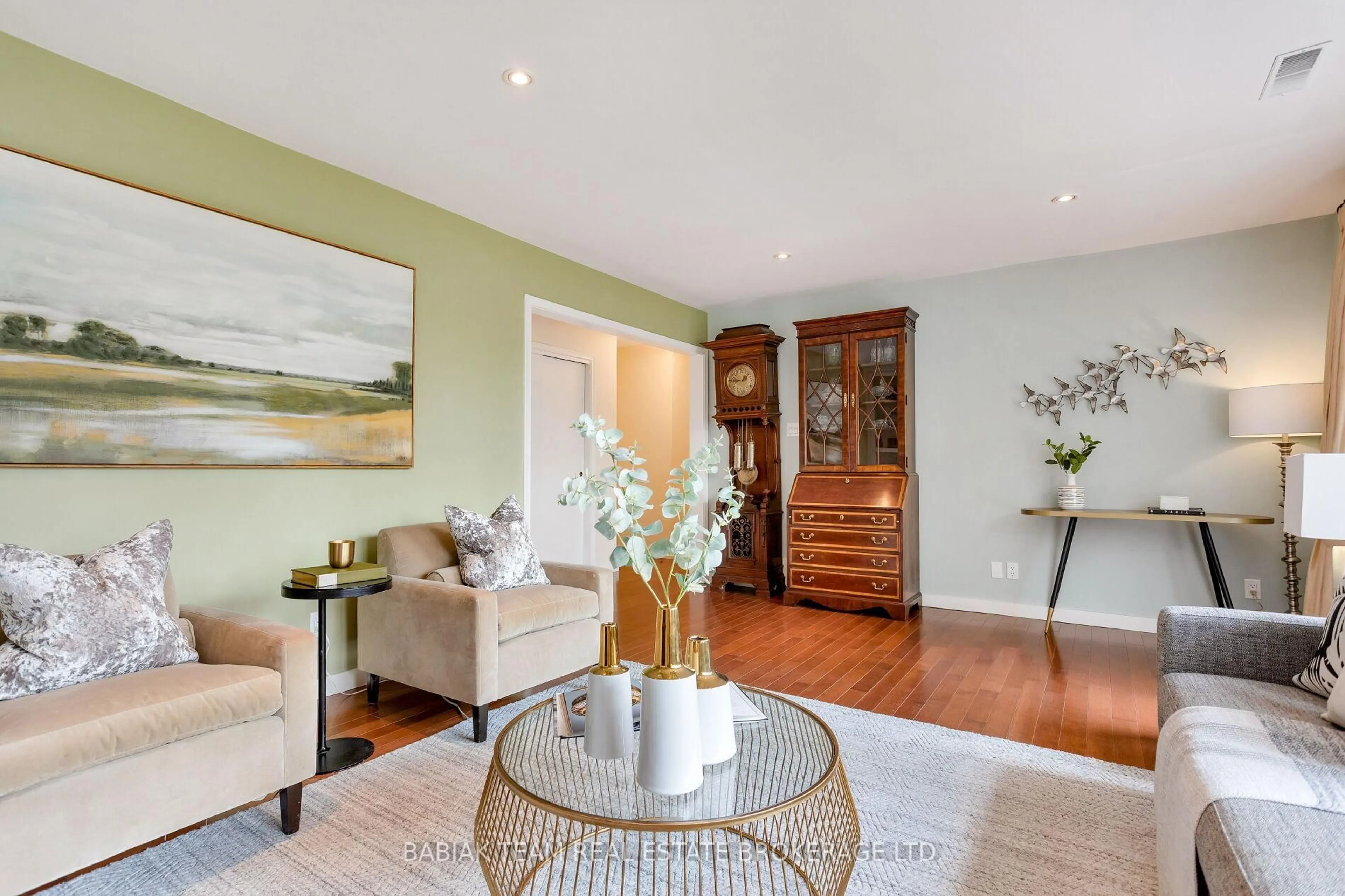Living room with furniture, wood/laminate floor for 85 Harshaw Ave, Toronto Ontario M6S 1X9