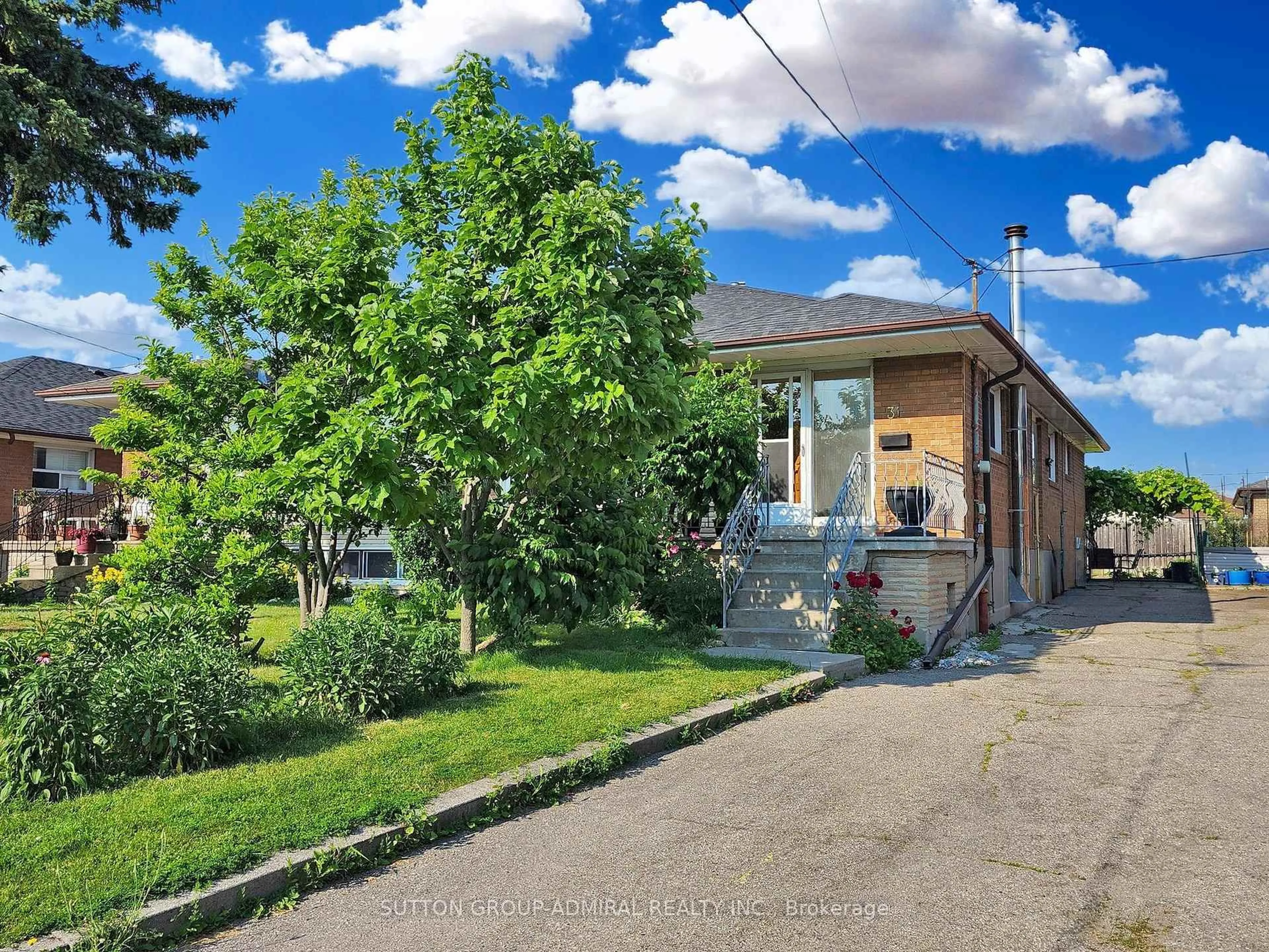 Home with brick exterior material, street for 31 Charrington Cres, Toronto Ontario M3L 2C3
