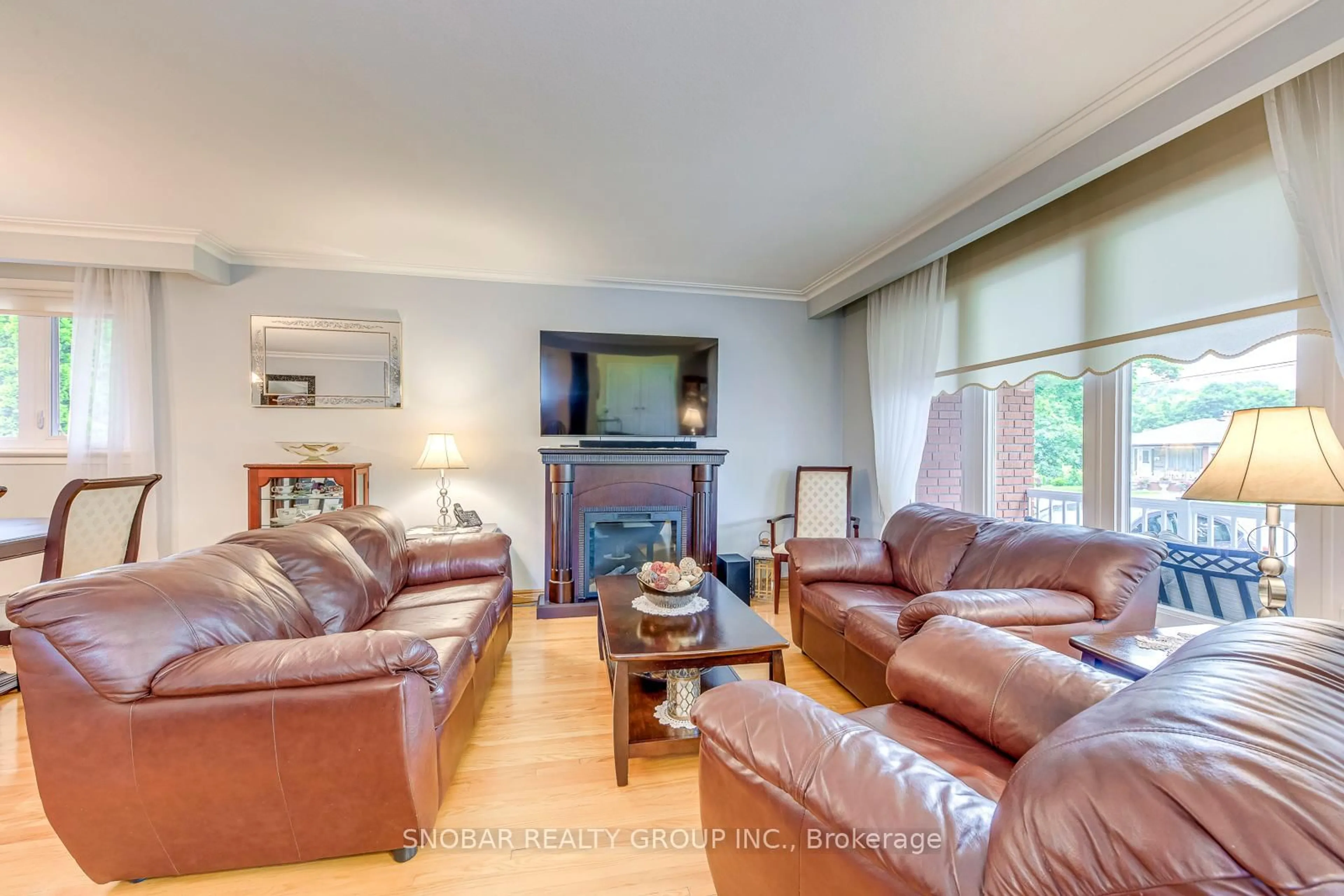 Living room with furniture, wood/laminate floor for 46 Northcrest Rd, Toronto Ontario M9R 1P9