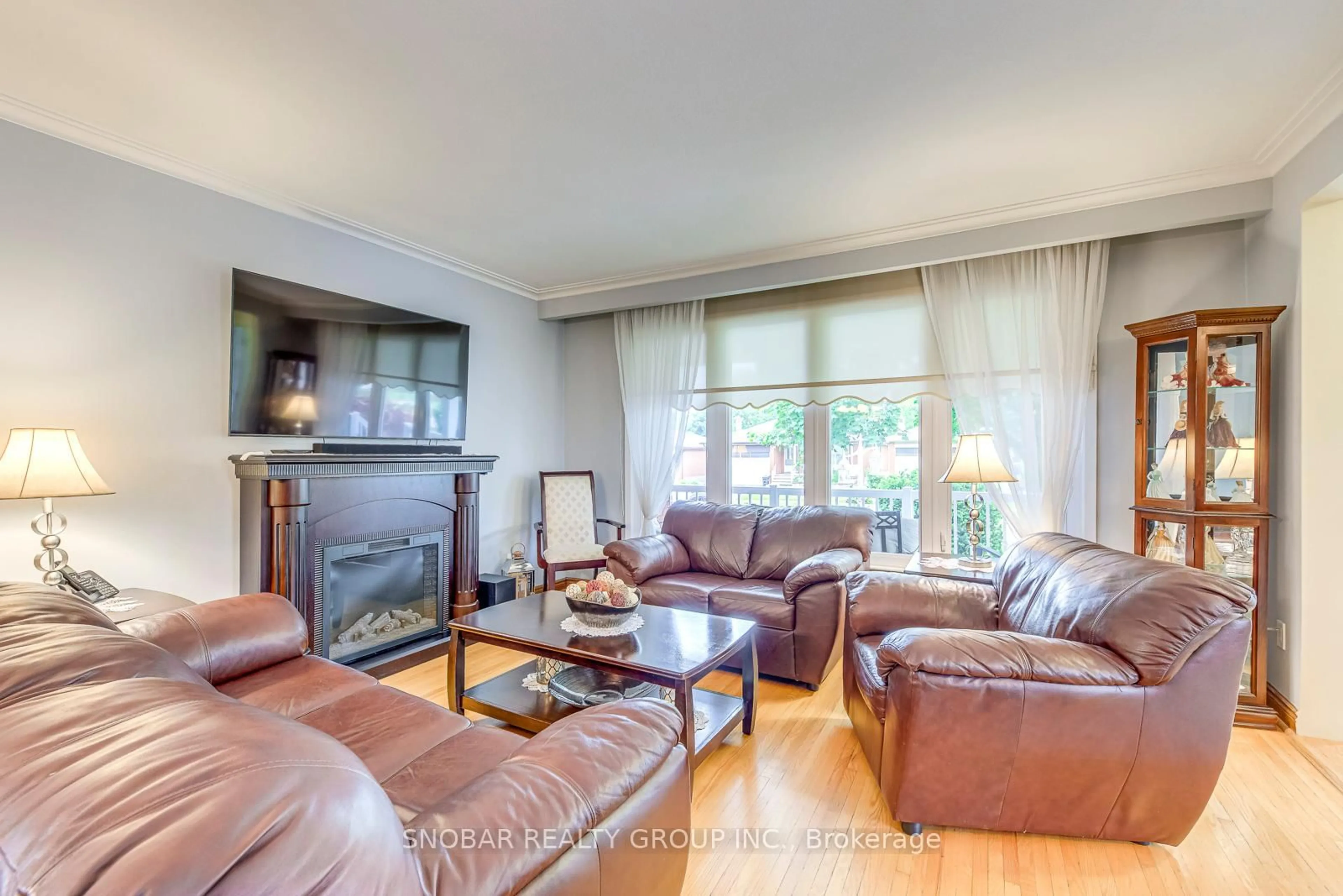 Living room with furniture, wood/laminate floor for 46 Northcrest Rd, Toronto Ontario M9R 1P9