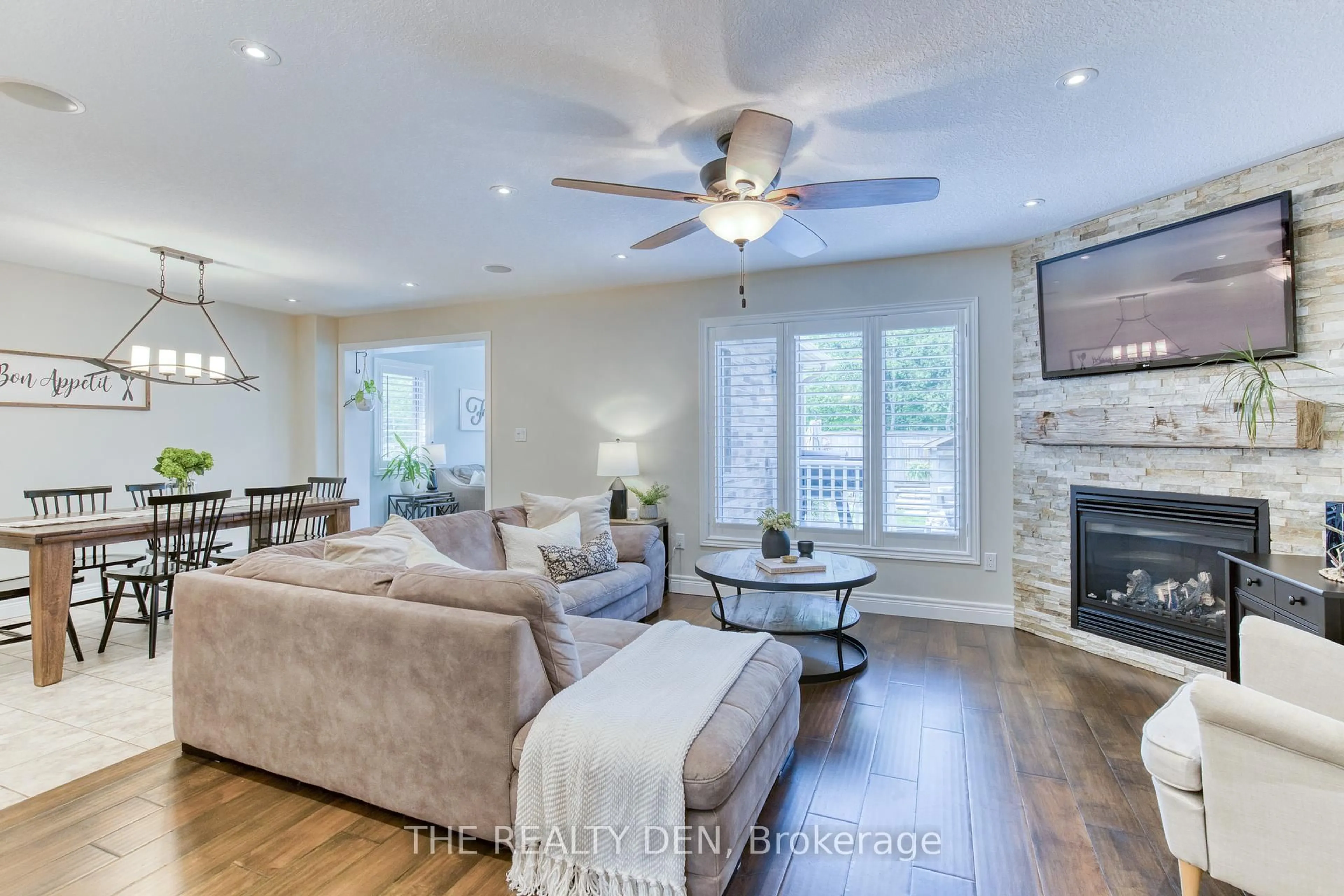 Living room with furniture, wood/laminate floor for 226 Churchill Rd, Halton Hills Ontario L7J 0A7
