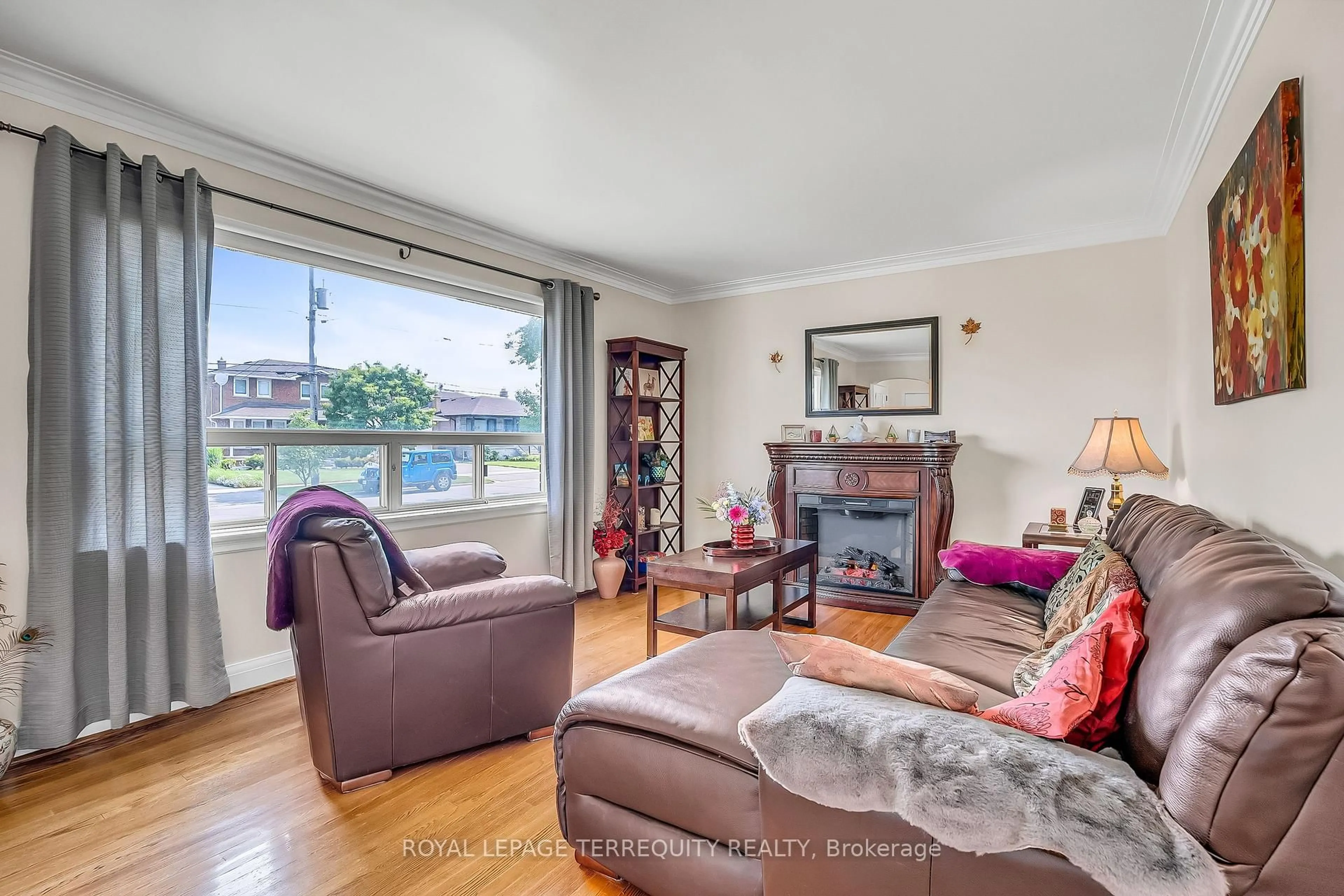 Living room with furniture, wood/laminate floor for 40 Whitley Ave, Toronto Ontario M3K 1A2
