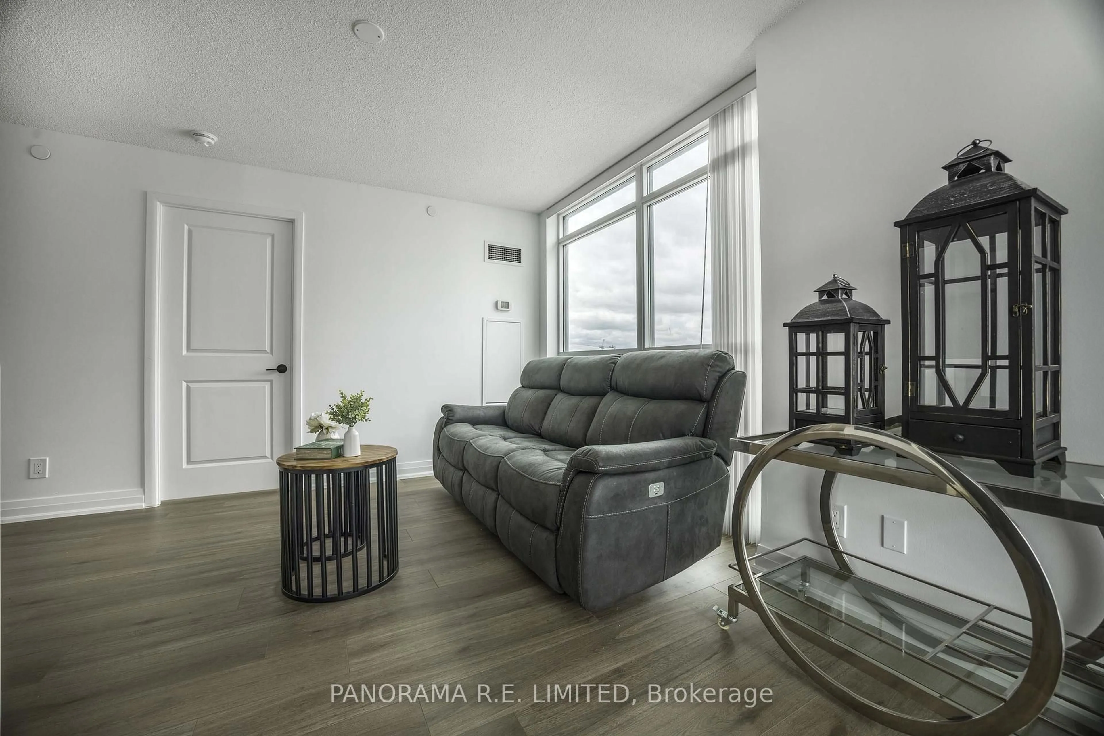 Living room with furniture, wood/laminate floor for 215 Sherway Gardens Rd #2110, Toronto Ontario M9C 0A4