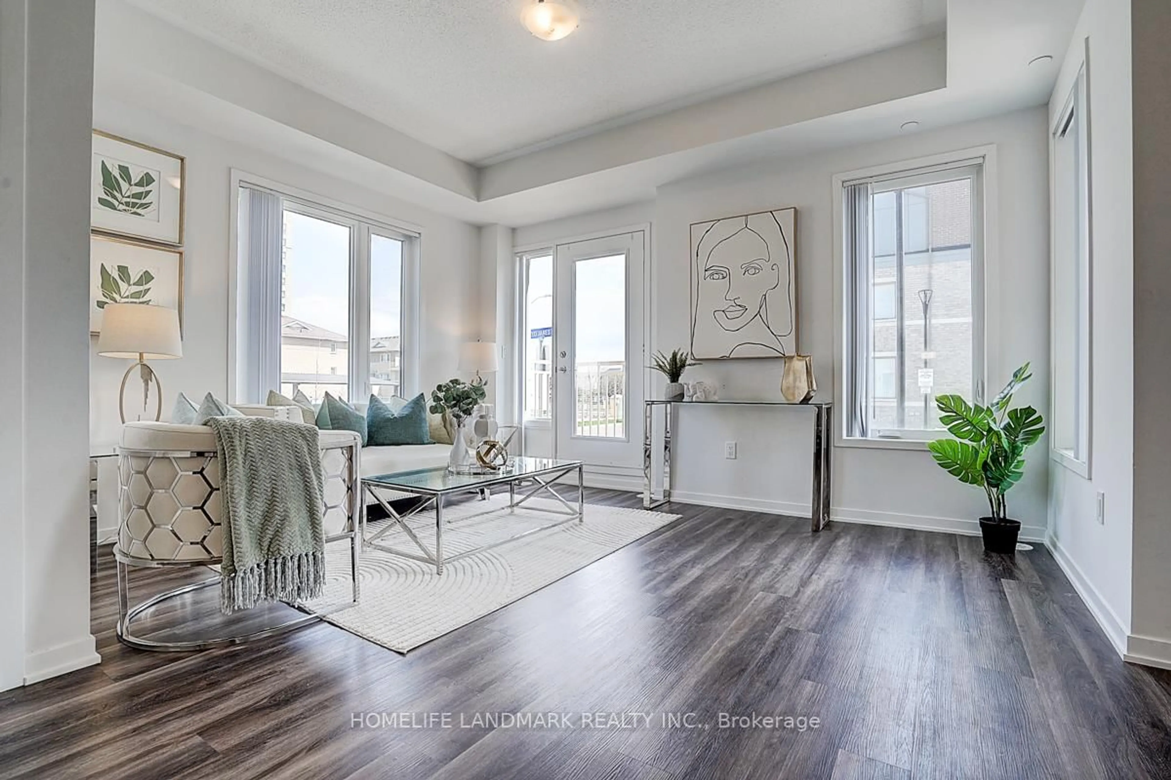 Living room with furniture, wood/laminate floor for 10 Lloyd Janes Lane #191, Toronto Ontario M8V 0J6