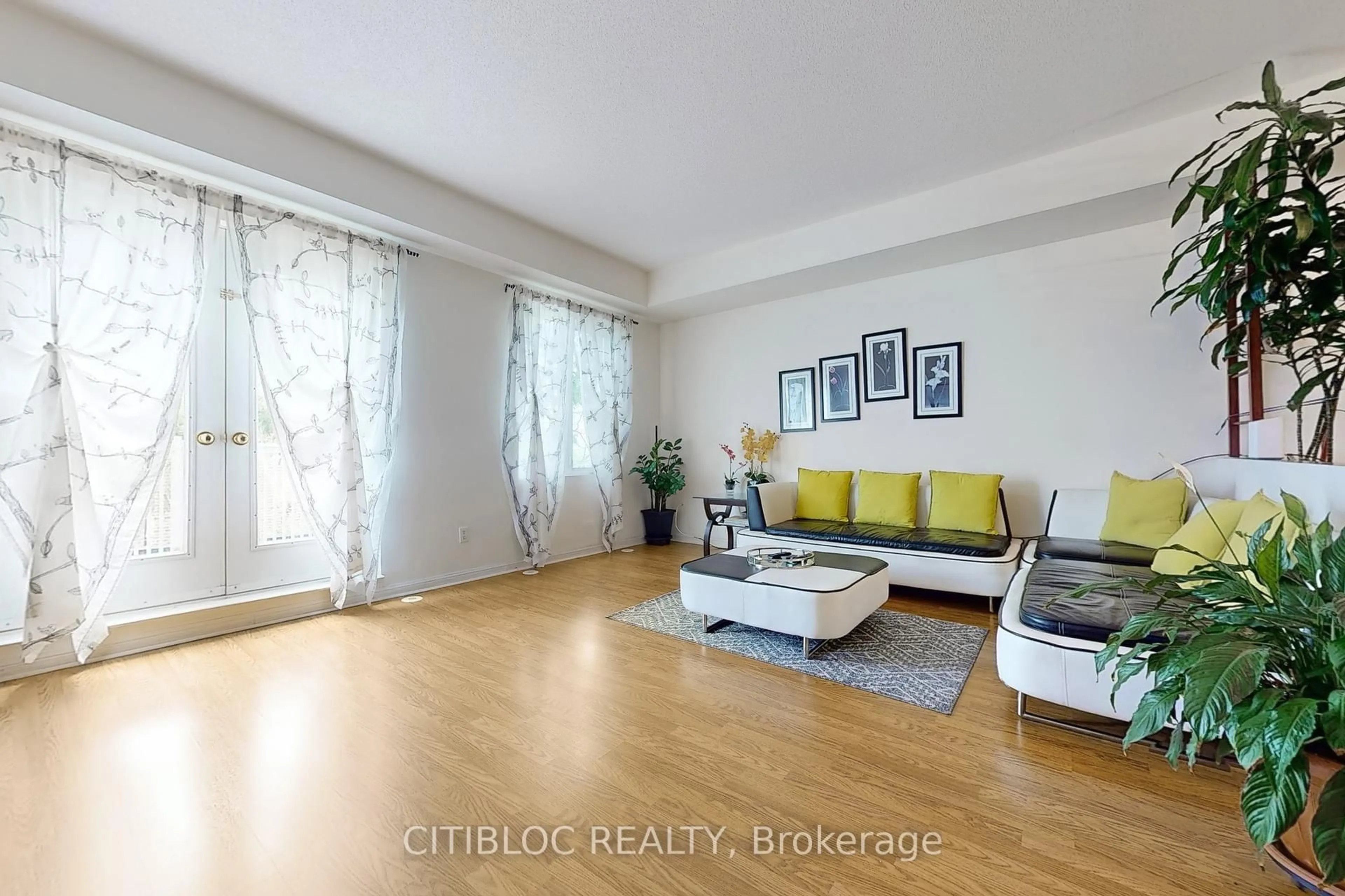 Living room with furniture, wood/laminate floor for 3029 Finch Ave #13, Toronto Ontario M9M 0A2