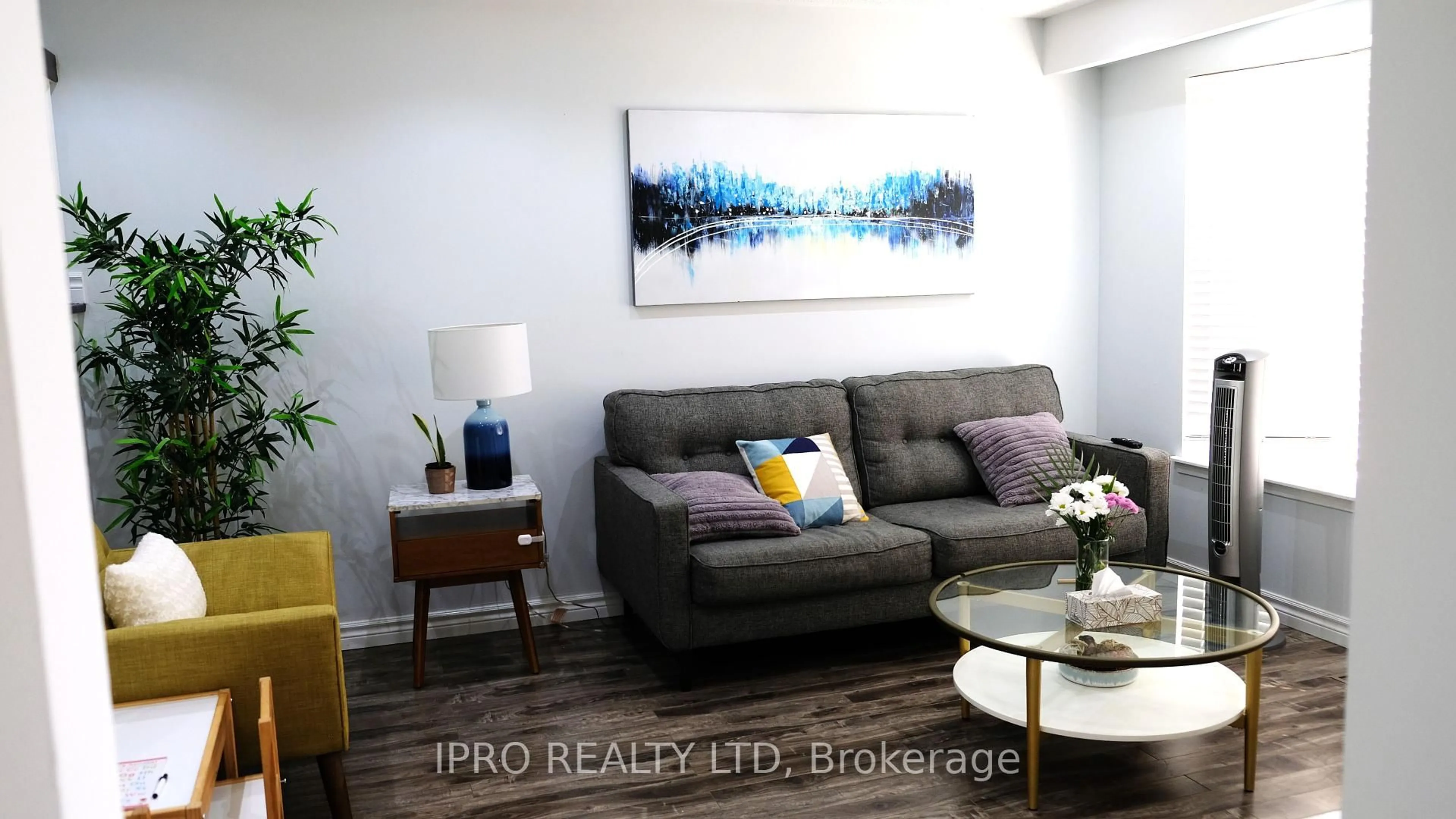 Living room with furniture, wood/laminate floor for 120 Hansen Rd, Brampton Ontario L6V 2G6