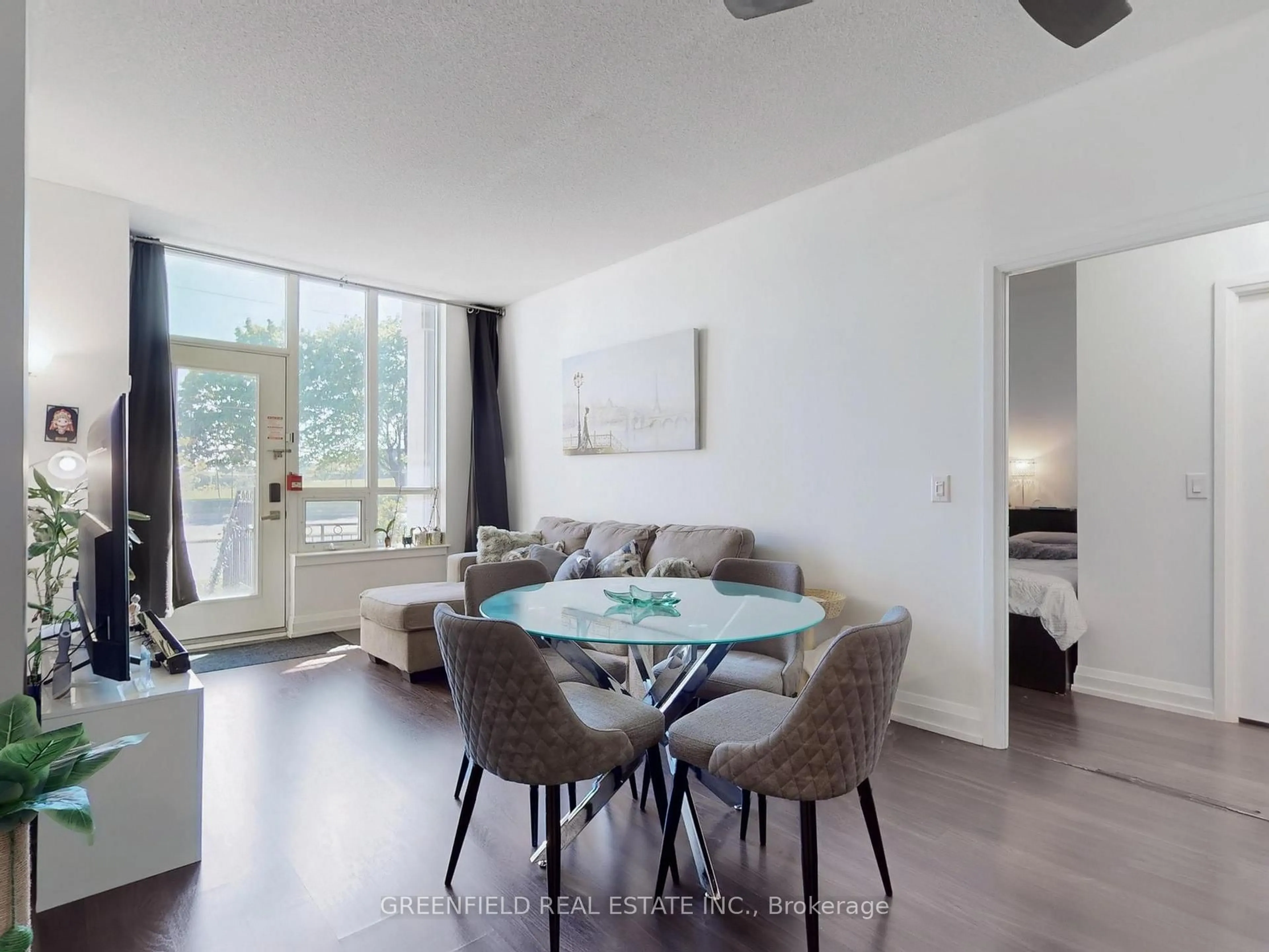 Living room with furniture, wood/laminate floor for 1070 Sheppard Ave #110, Toronto Ontario M3J 0G8