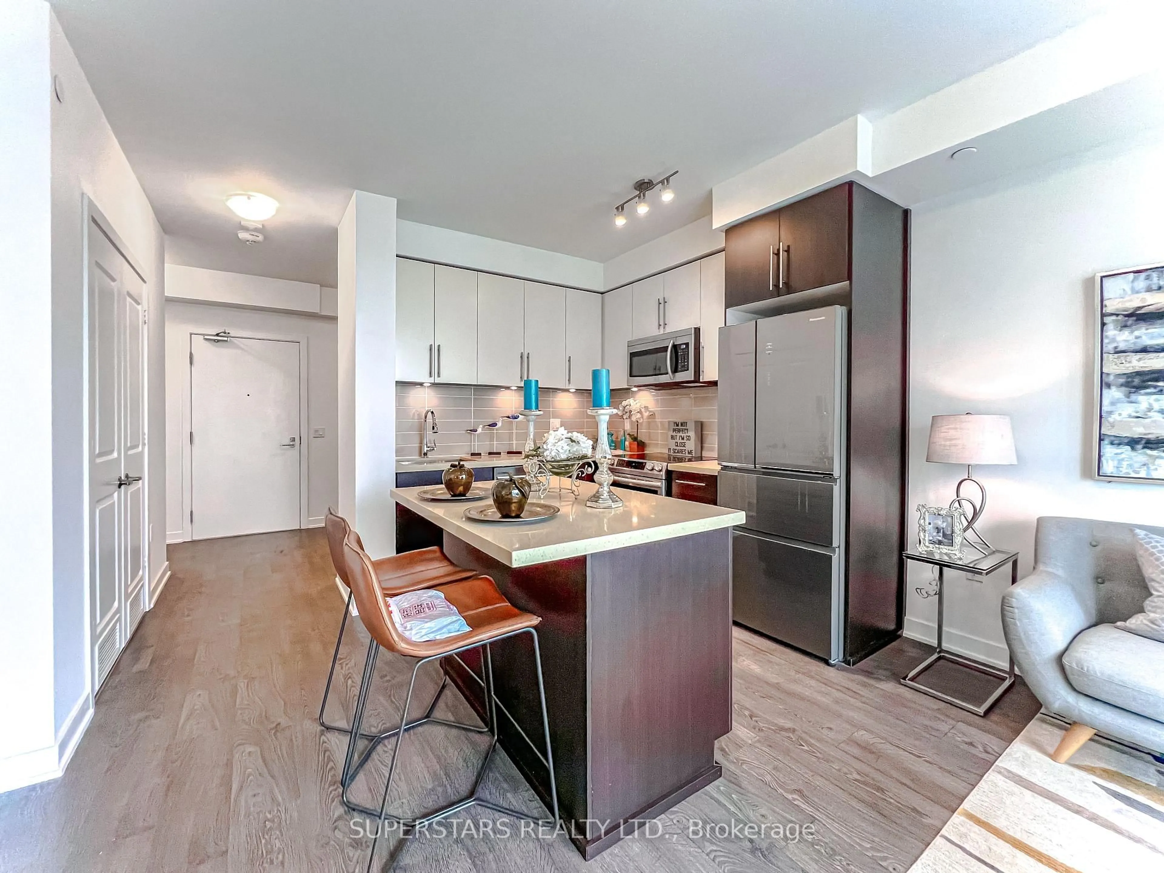 Open concept kitchen, wood/laminate floor for 4677 Glen Erin Dr #1703, Mississauga Ontario L5M 2E3