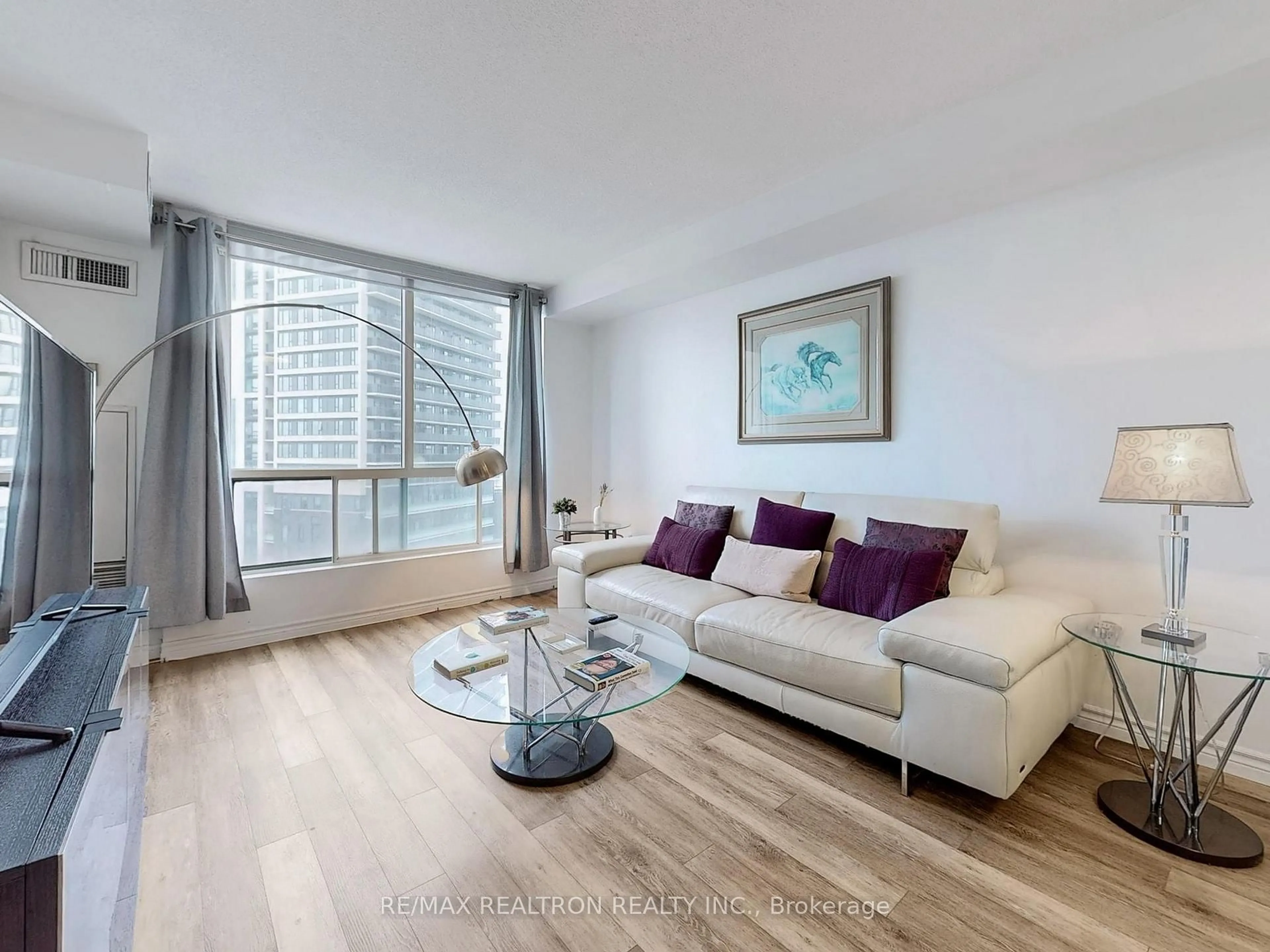 Living room with furniture, wood/laminate floor for 101 Subway Cres #912, Toronto Ontario M9B 6K4