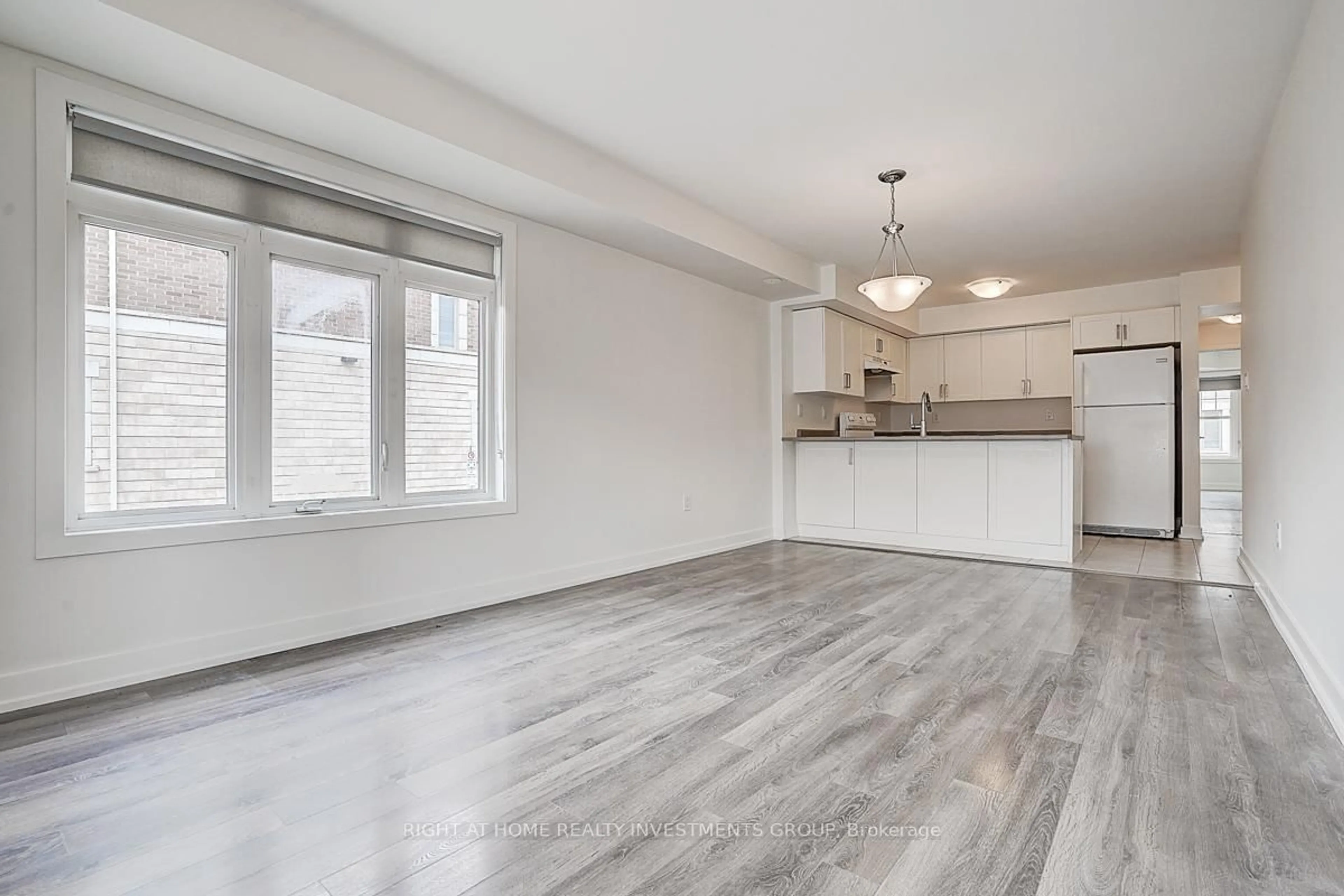 Open concept kitchen, wood/laminate floor for 100 Parrotta Dr #116, Toronto Ontario M9M 0B5