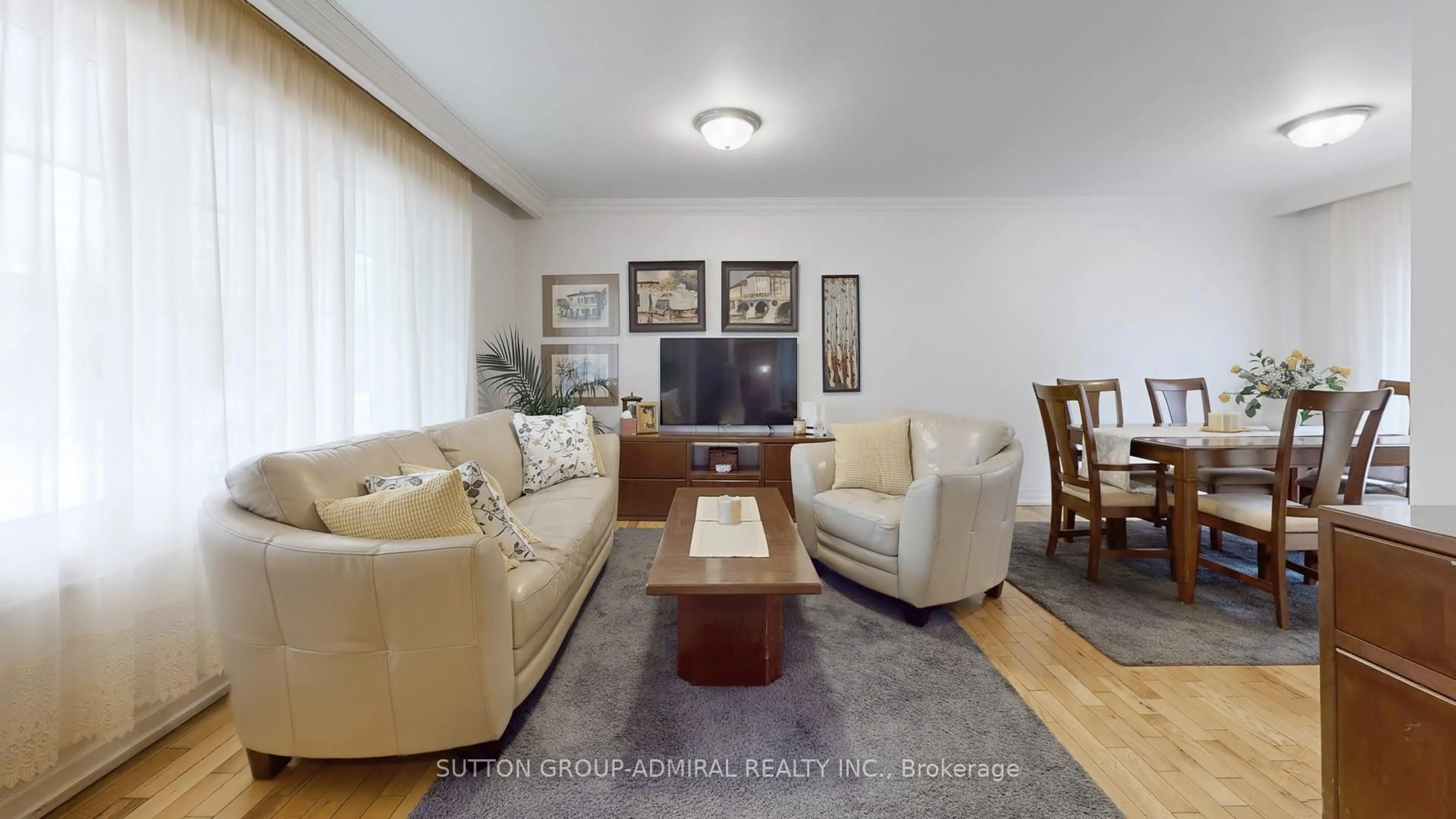 Living room with furniture, wood/laminate floor for 2 Winterton Dr, Toronto Ontario M9B 3G5