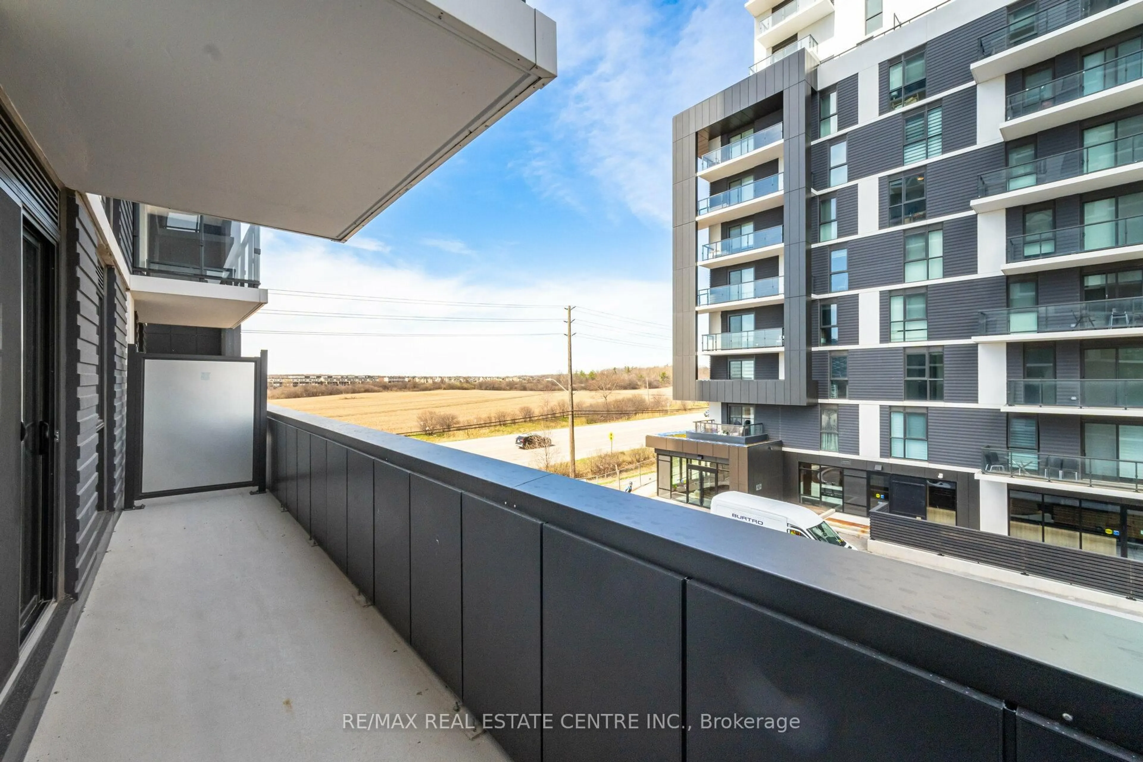 Balcony in the apartment, city buildings view from balcony for 335 Wheat Boom Dr #315, Oakville Ontario L6H 7X4
