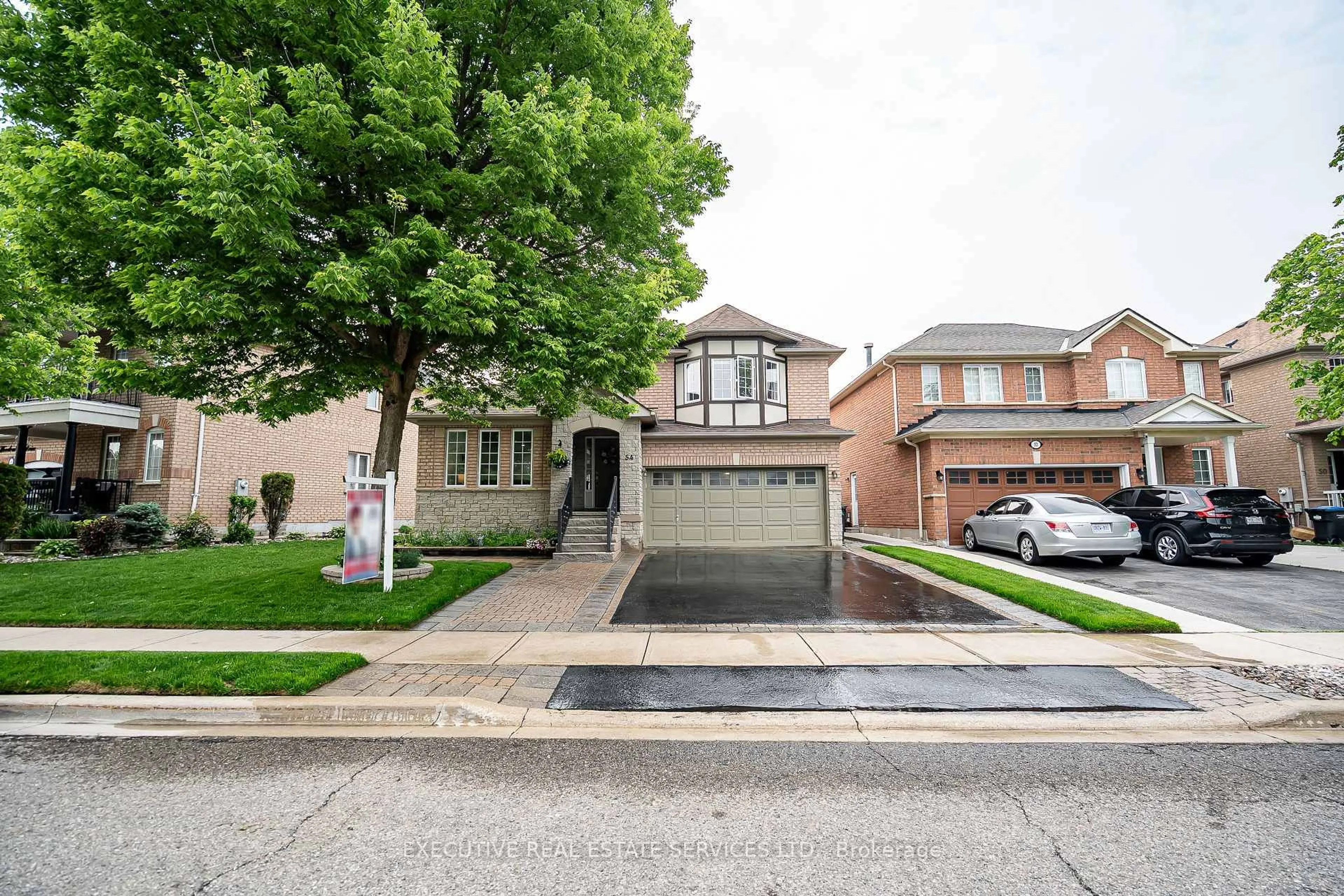 Home with brick exterior material, street for 54 Woodvalley Dr, Brampton Ontario L7A 1Z3