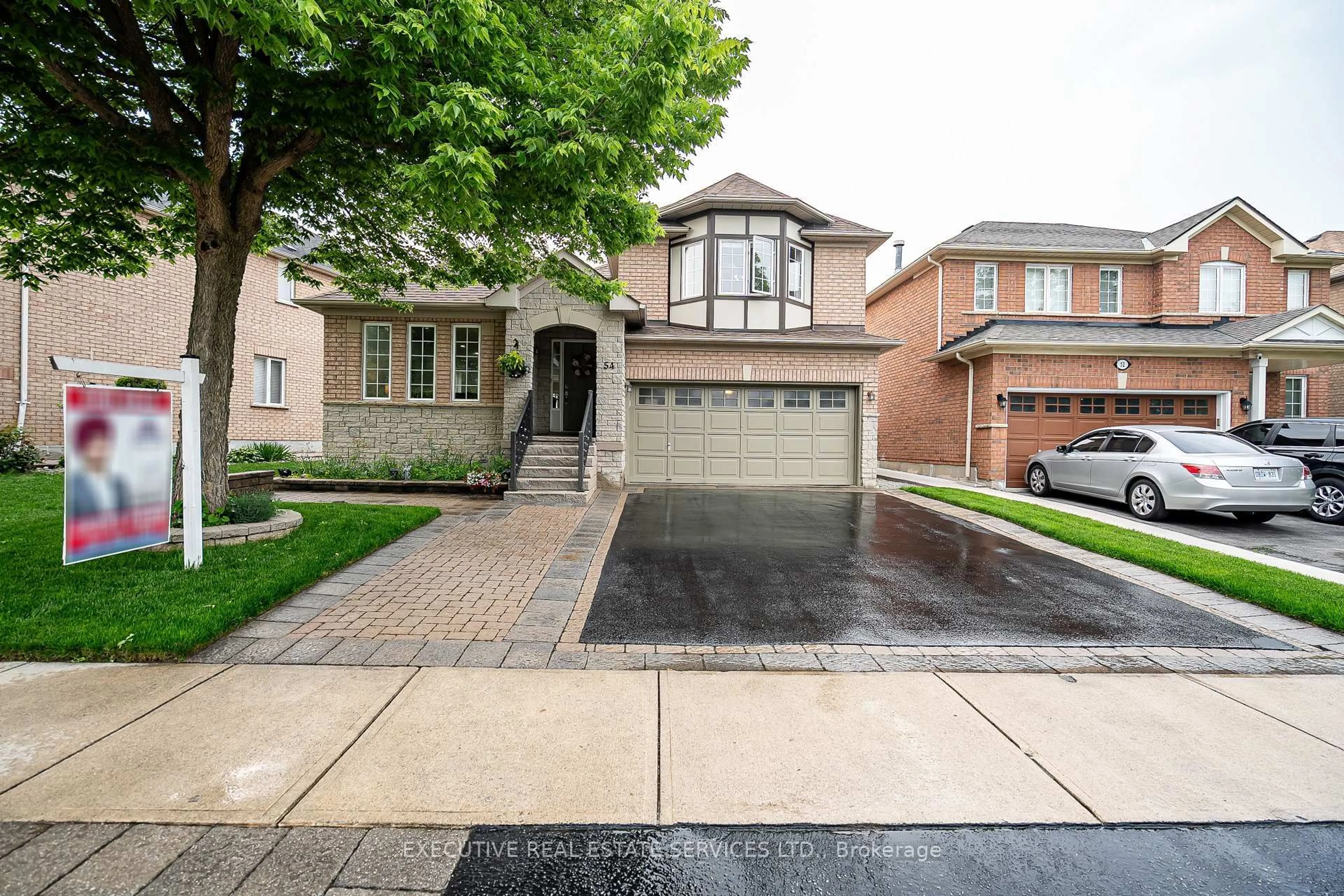 Home with brick exterior material, street for 54 Woodvalley Dr, Brampton Ontario L7A 1Z3