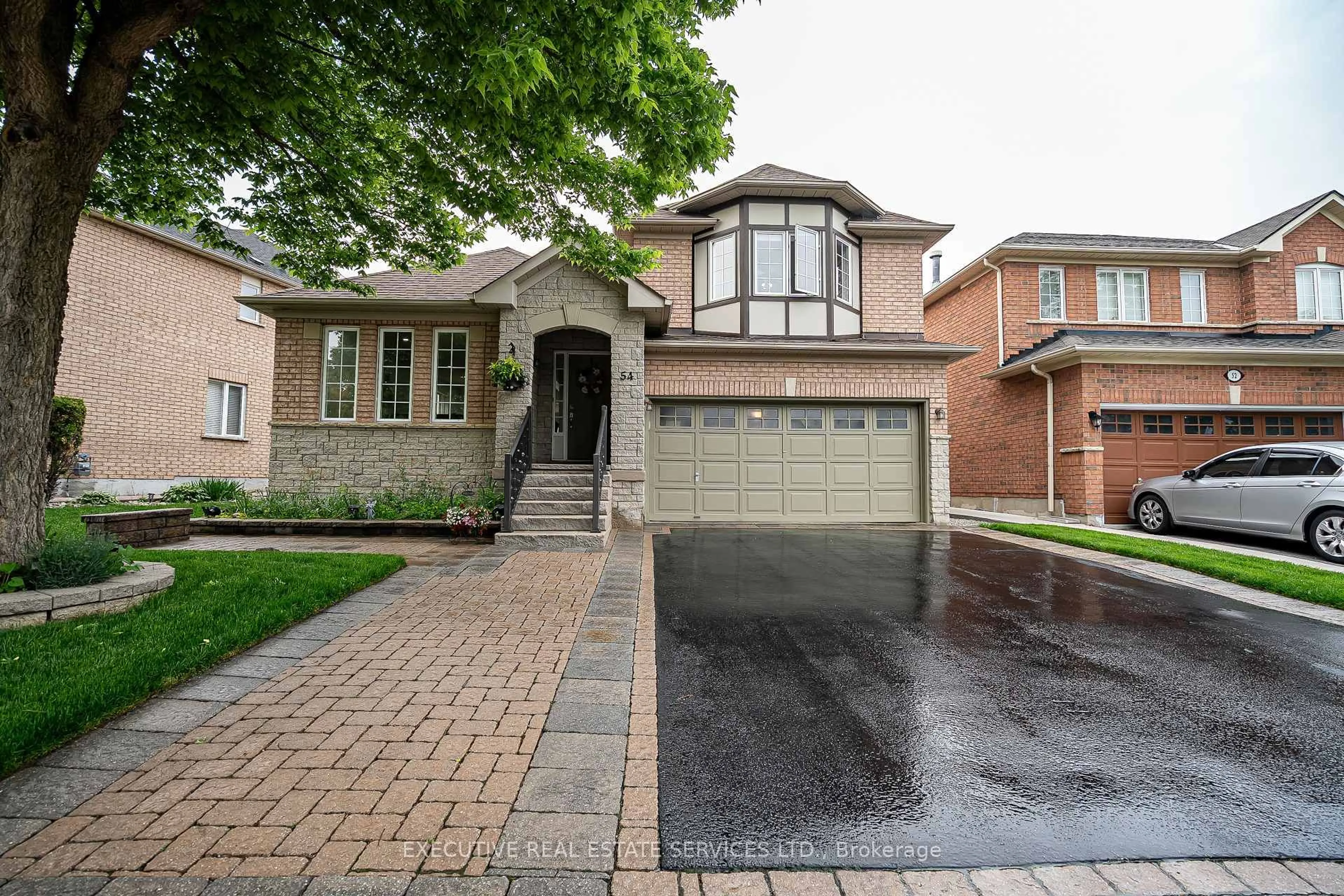 Home with brick exterior material, street for 54 Woodvalley Dr, Brampton Ontario L7A 1Z3