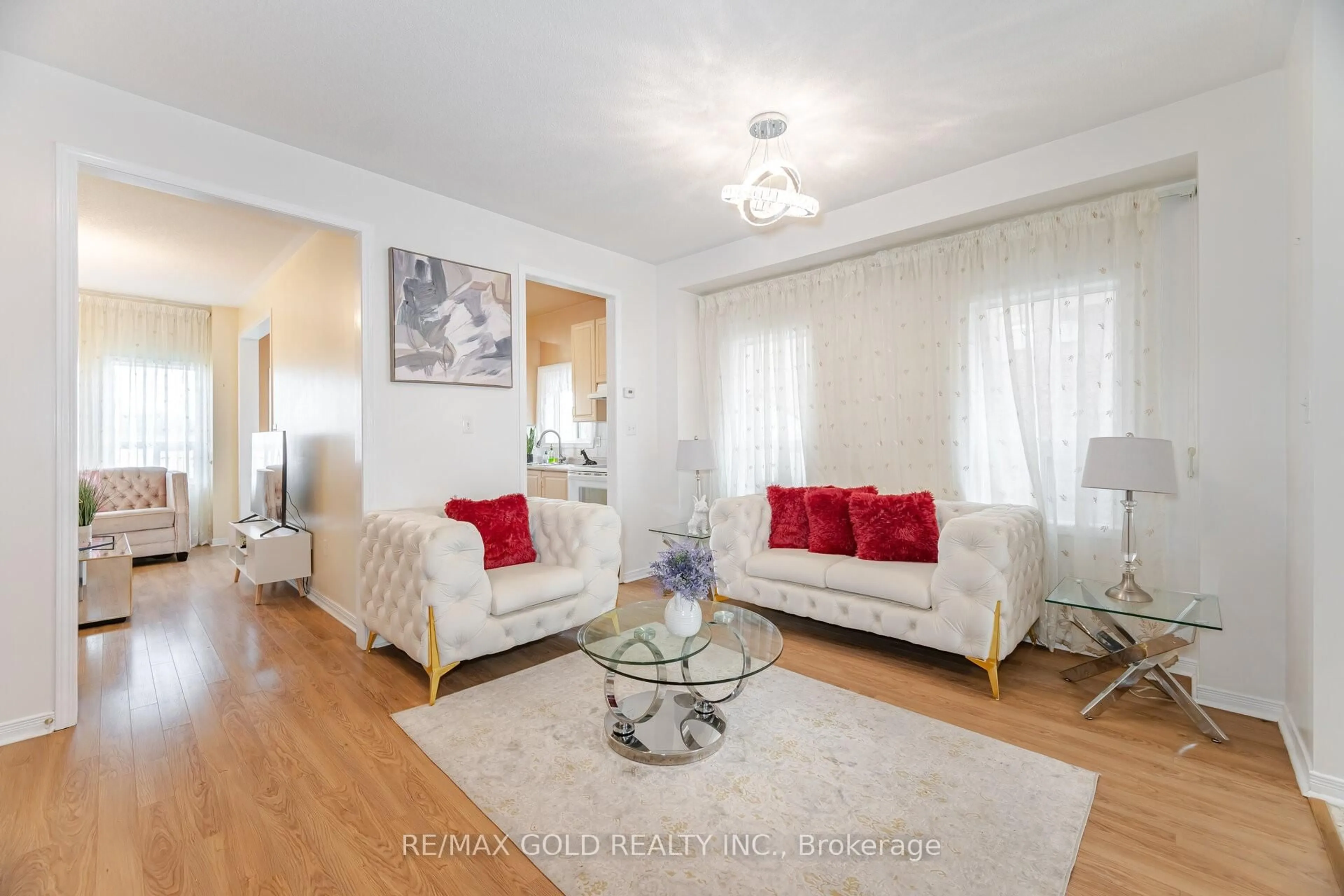 Living room with furniture, wood/laminate floor for 88 Kettlewell Cres, Brampton Ontario L6R 0T1