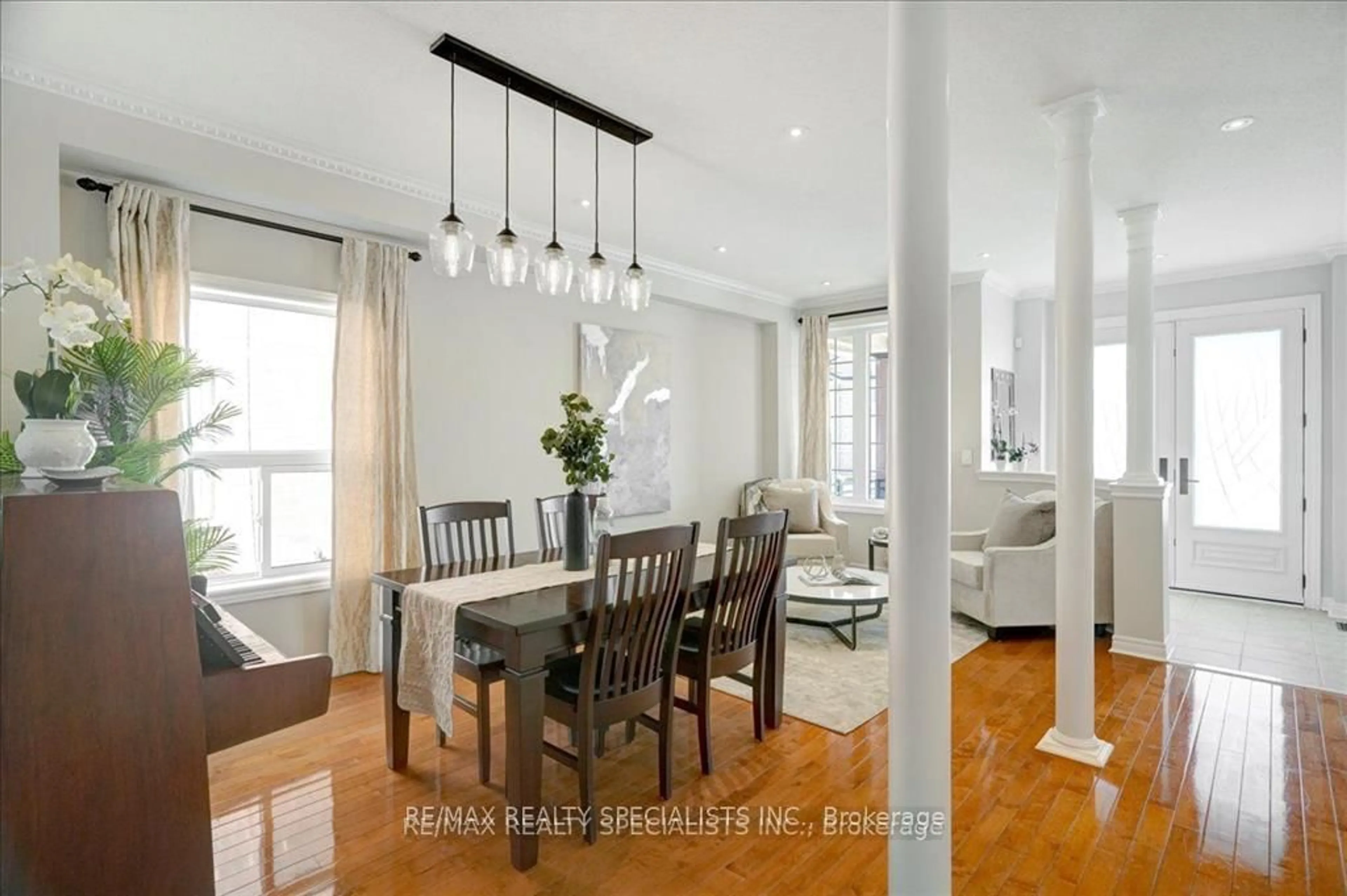 Dining room, wood/laminate floor for 104 Earlsbridge Blvd, Brampton Ontario L7A 3W7