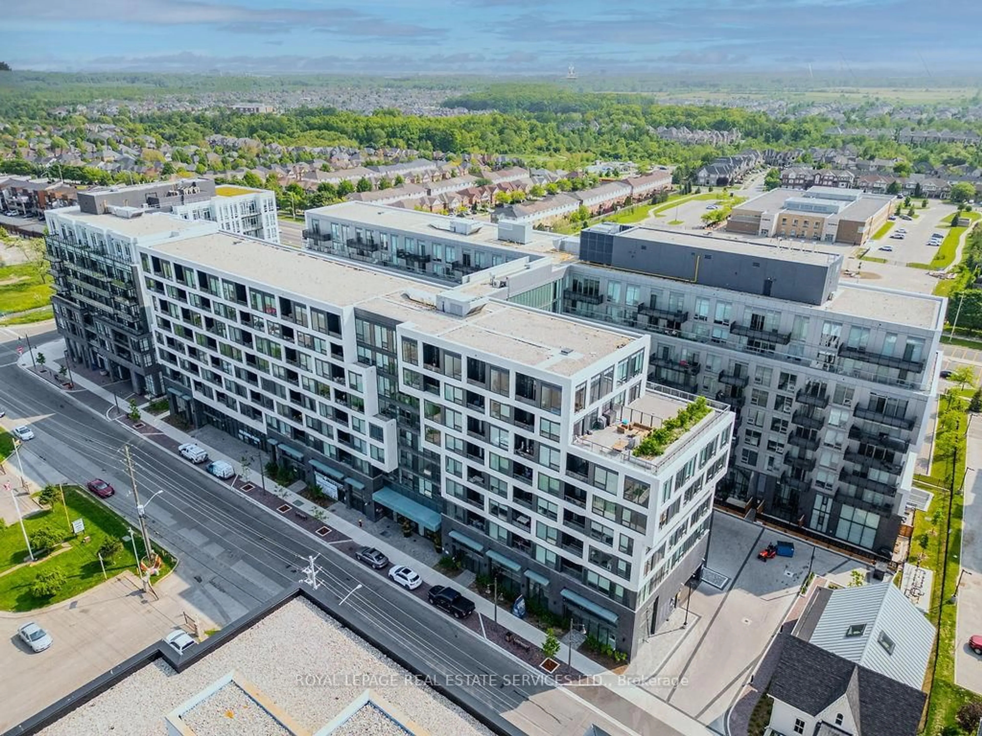 A pic from outside/outdoor area/front of a property/back of a property/a pic from drone, city buildings view from balcony for 2450 Old Bronte Rd #229, Oakville Ontario L6M 5P6