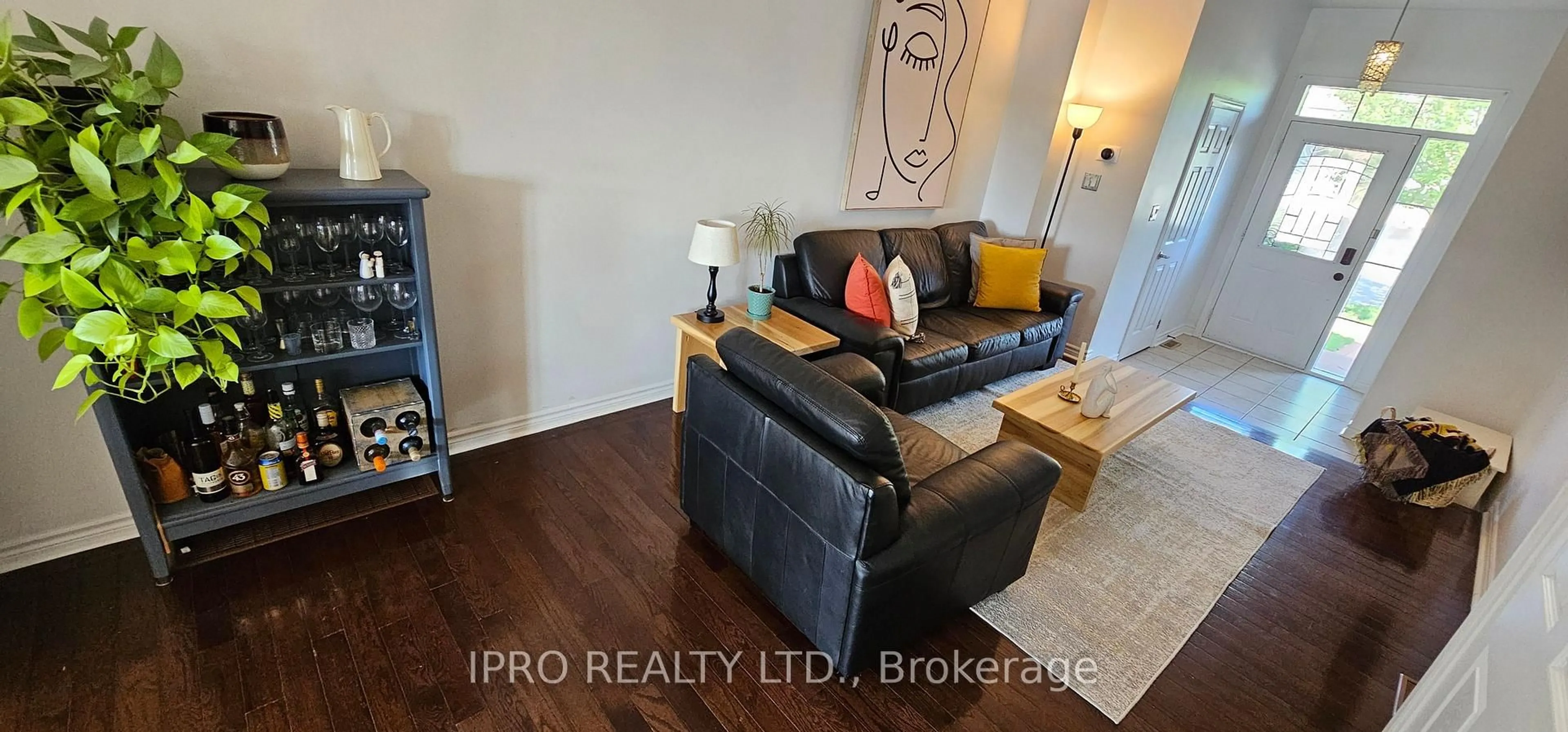 Living room with furniture, wood/laminate floor for 355 Hobbs Cres, Milton Ontario L9T 0J3
