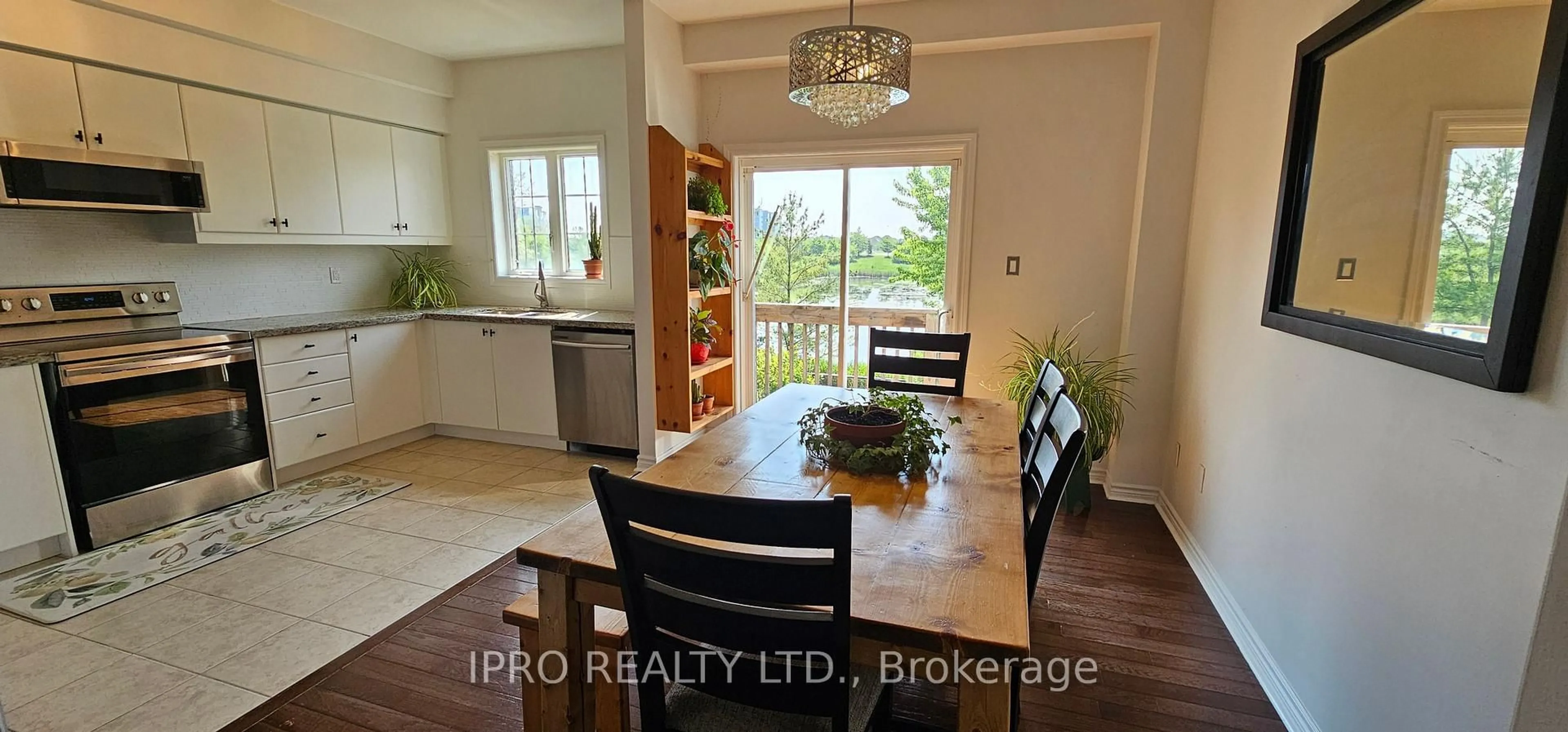 Open concept kitchen, wood/laminate floor for 355 Hobbs Cres, Milton Ontario L9T 0J3