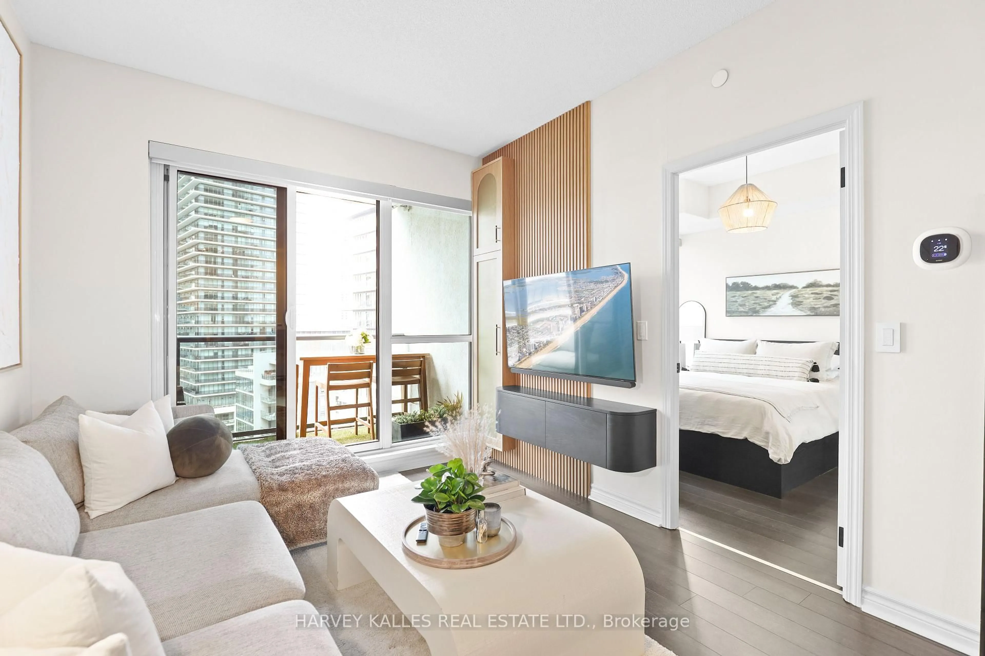 Living room with furniture, wood/laminate floor for 39 Annie Craig Dr #1403, Toronto Ontario M8V 0H1