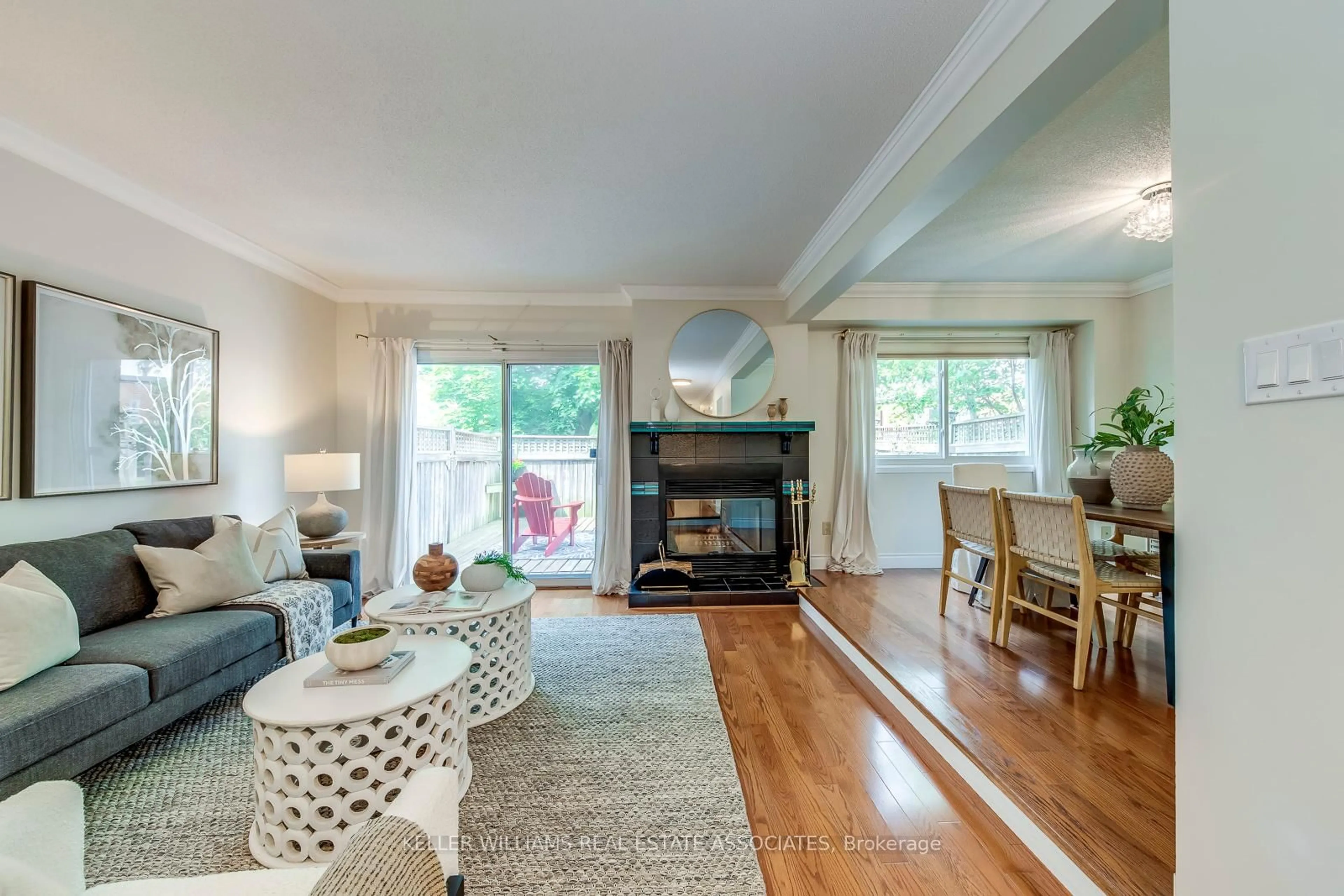 Living room with furniture, wood/laminate floor for 3050 Orleans Rd #63, Mississauga Ontario L5L 5P7