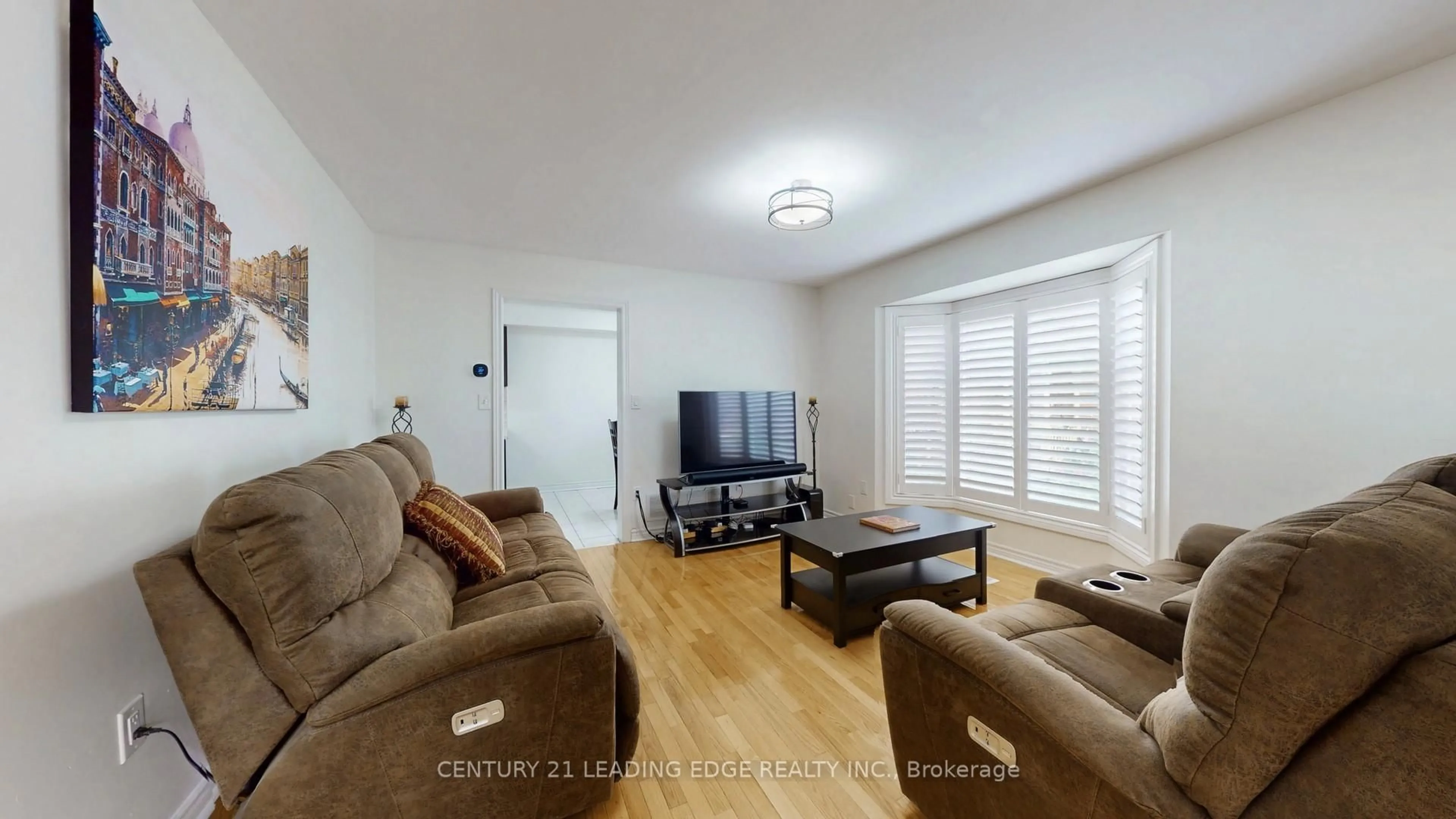 Living room with furniture, wood/laminate floor for 17 Pressed Brick Dr, Brampton Ontario L6V 4K3