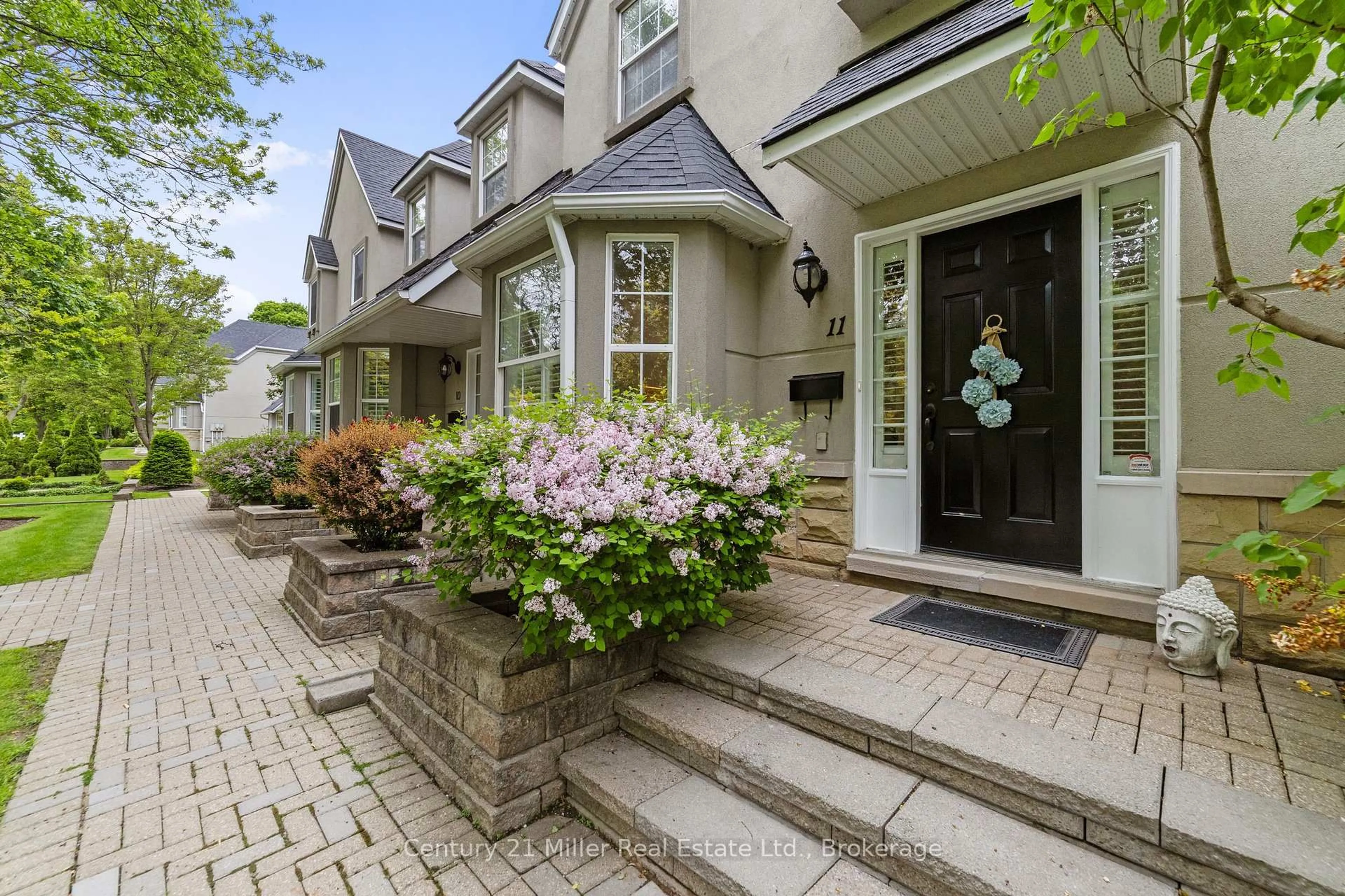 Home with brick exterior material, street for 1061 North Shore Blvd #11, Burlington Ontario L7T 1X9