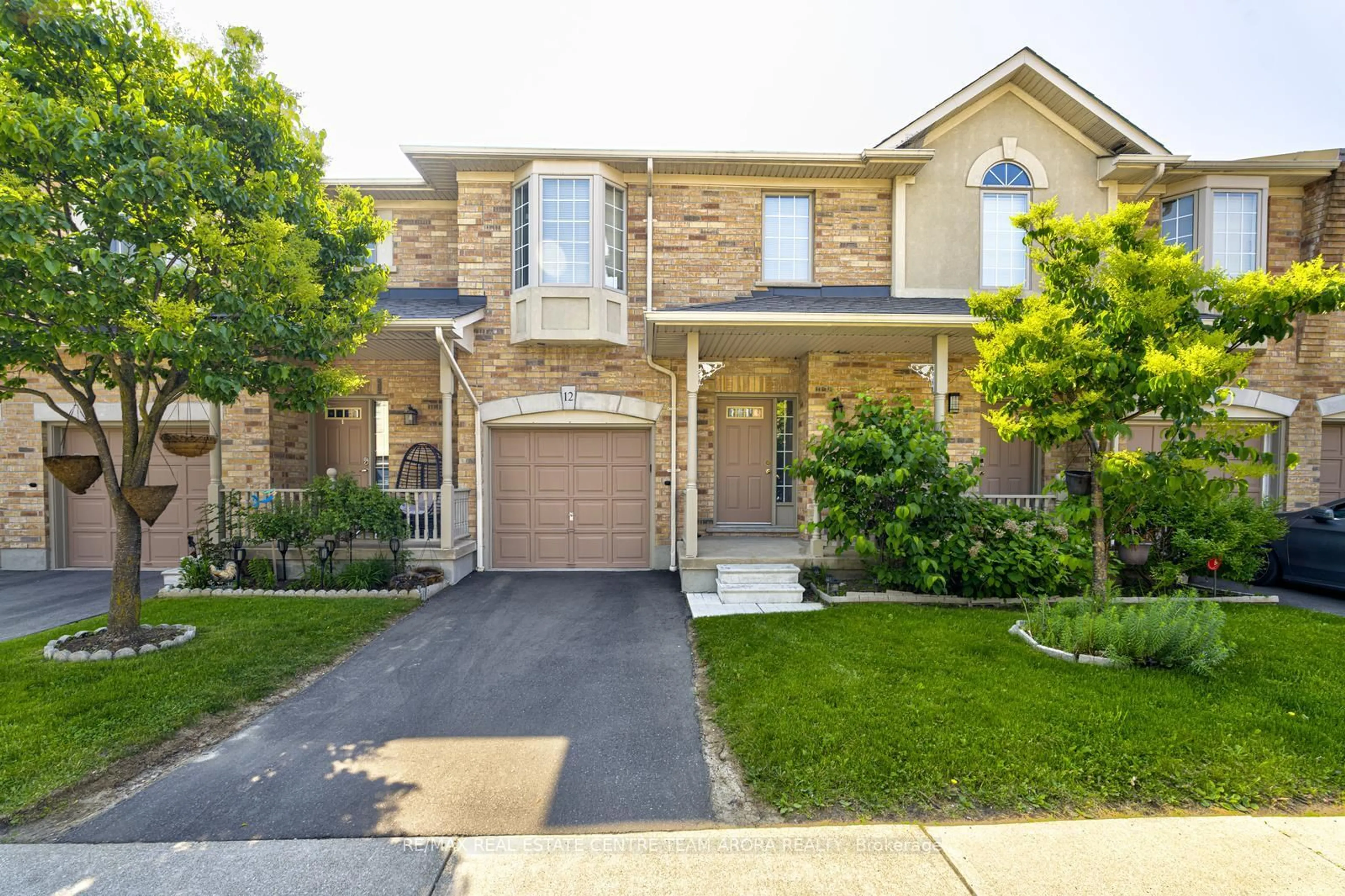 Home with brick exterior material, street for 7385 Magistrate Terr #12, Mississauga Ontario L5W 1W8