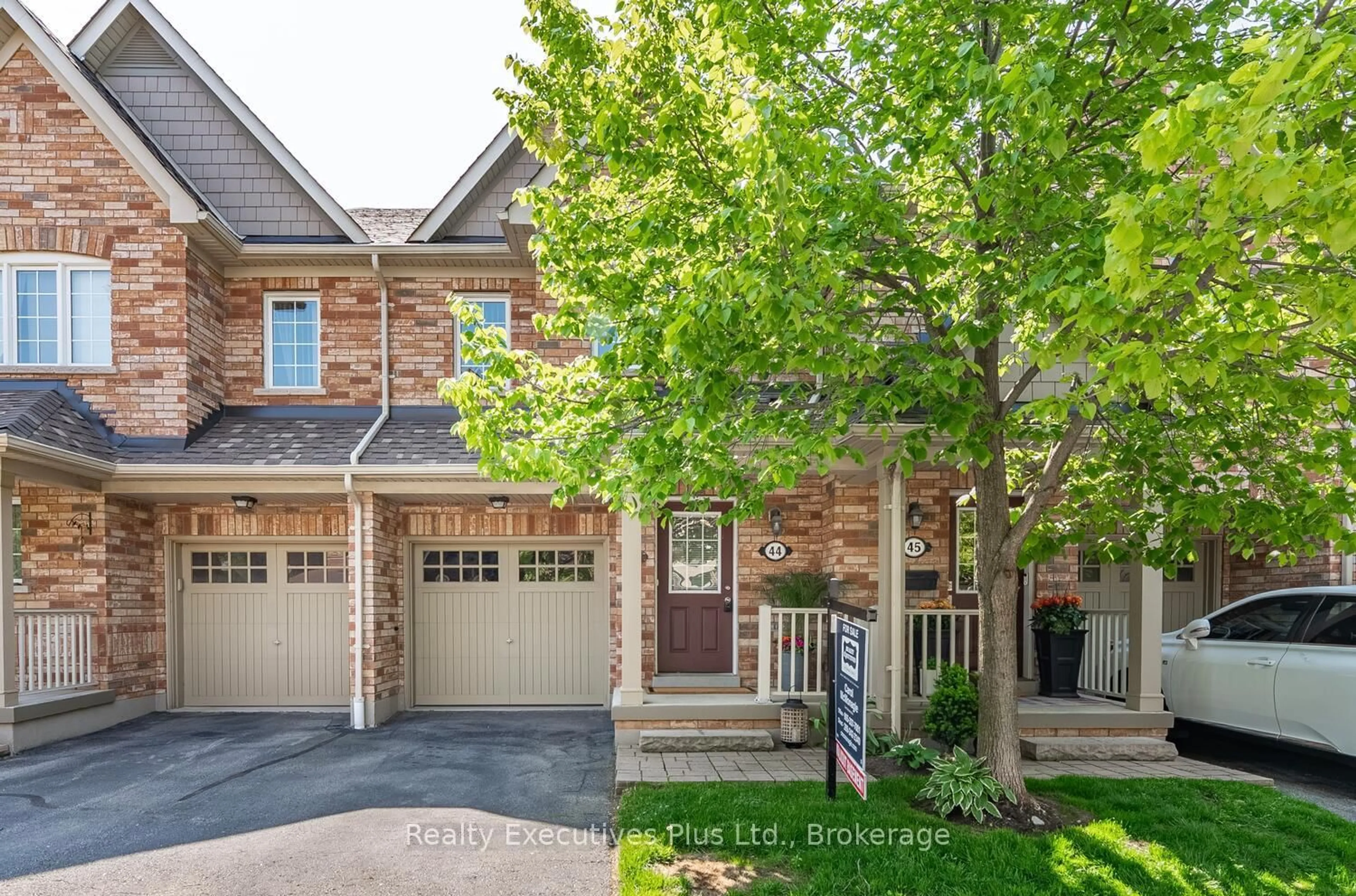 Home with brick exterior material, street for 233 Duskywing Way #44, Oakville Ontario L6L 0C5