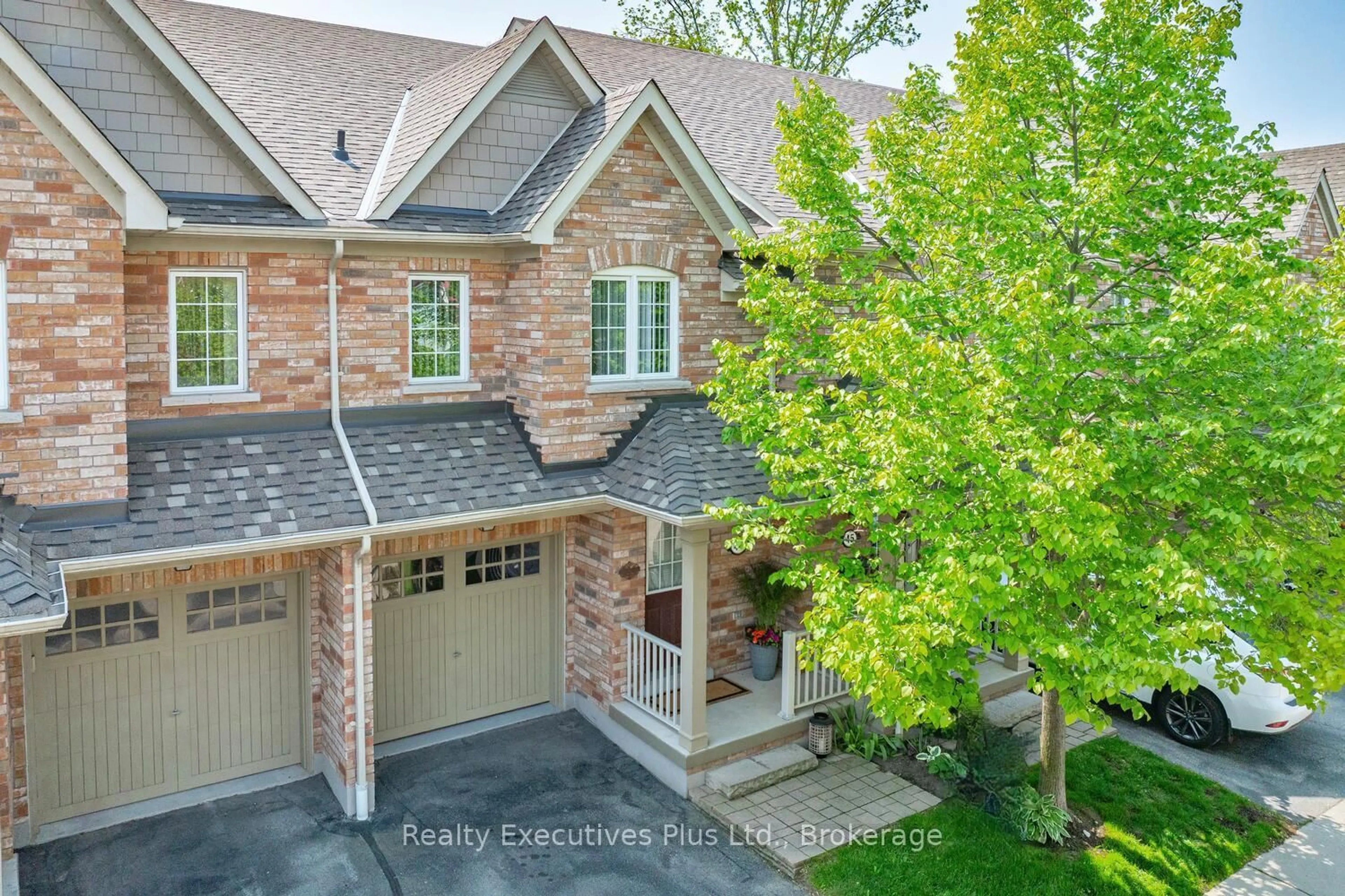 Home with brick exterior material, street for 233 Duskywing Way #44, Oakville Ontario L6L 0C5