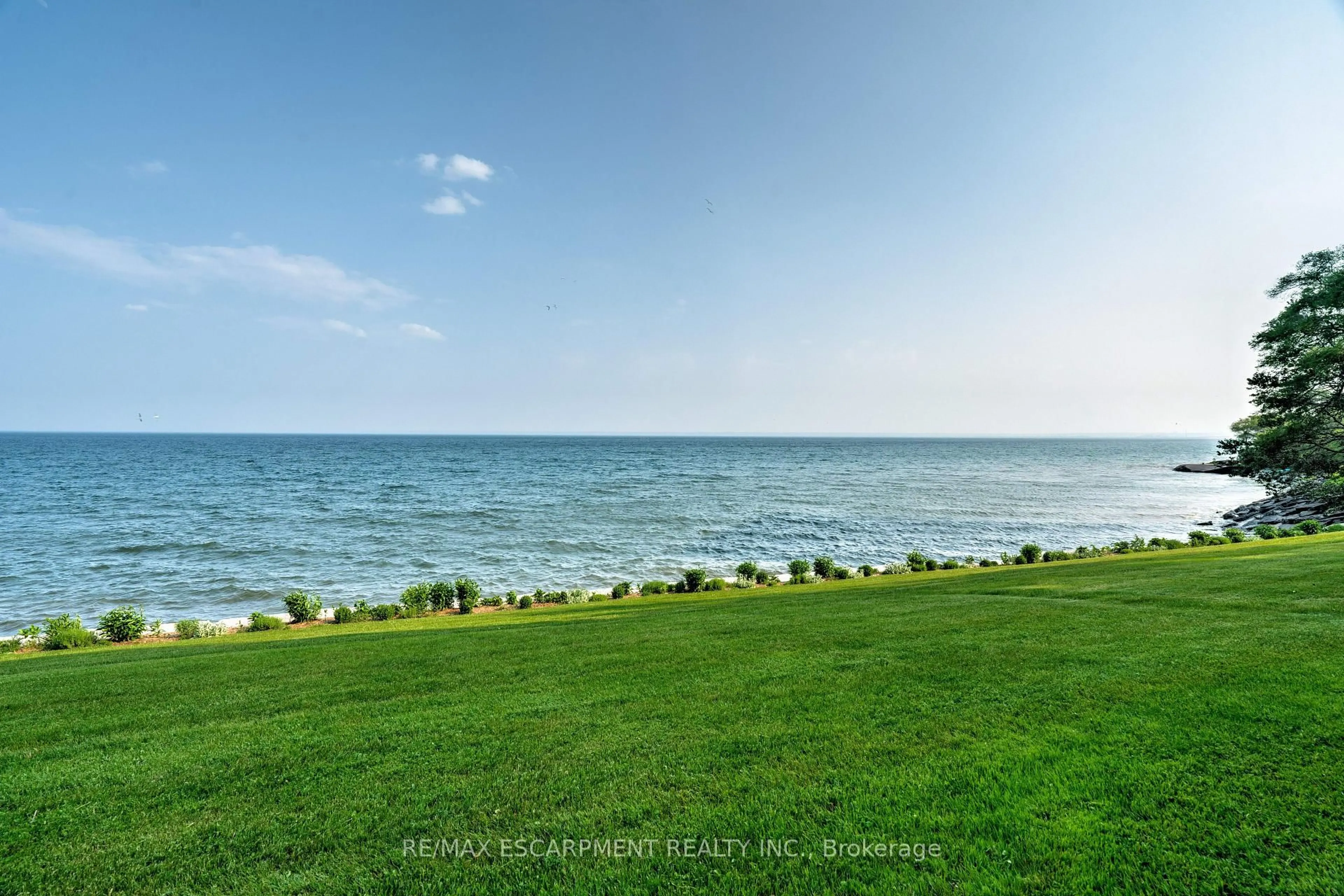 A pic from outside/outdoor area/front of a property/back of a property/a pic from drone, water/lake/river/ocean view for 5280 Lakeshore Rd #205, Burlington Ontario L7L 5R1